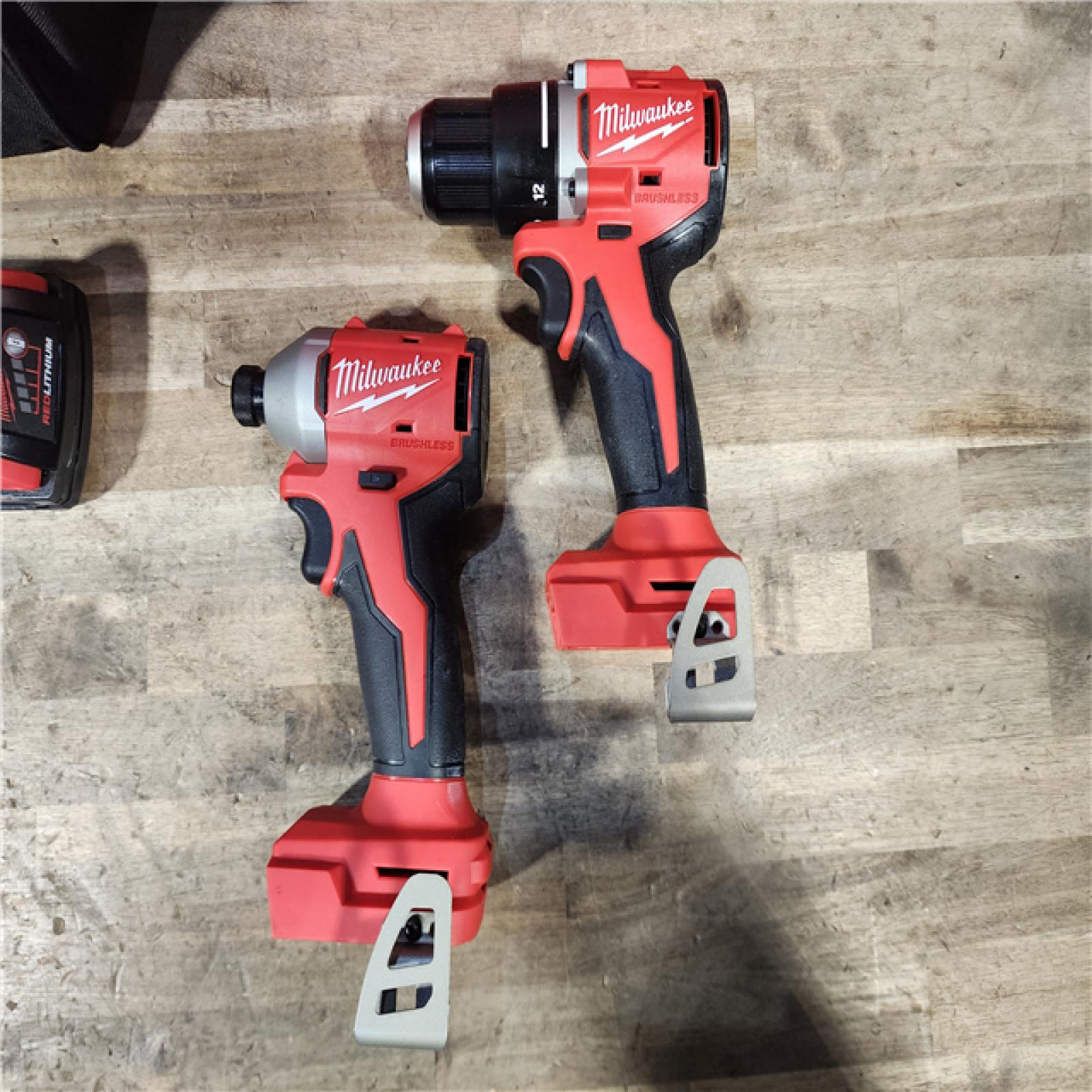 HOUSTON LOCATION - AS-IS Milwaukee M18 18V Lithium-Ion Brushless Cordless Compact Drill/Impact Combo Kit (2-Tool) W/(2) 2.0 Ah Batteries  Charger & Bag