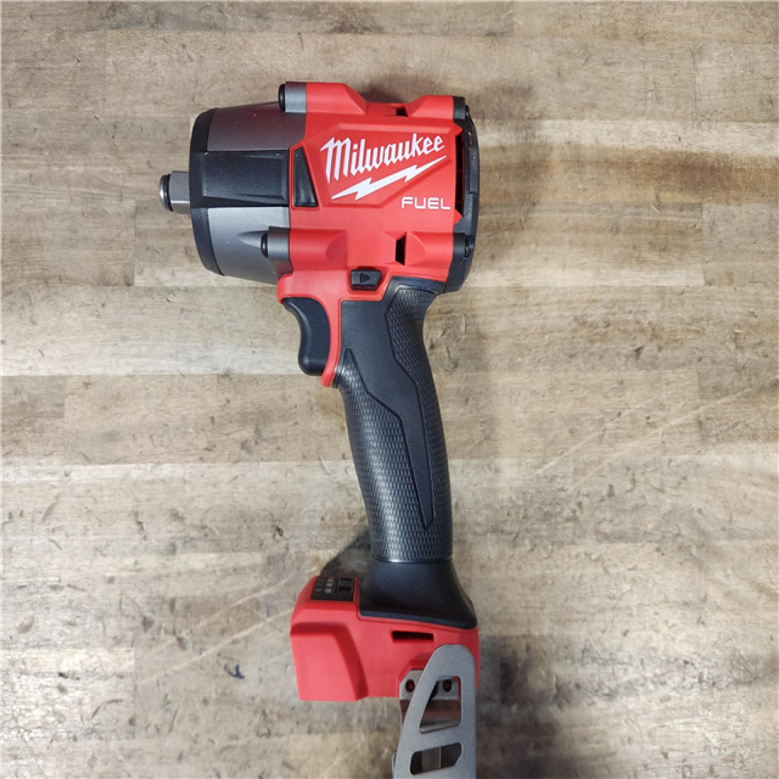 HOUSTON LOCATION - AS-IS (APPEARS LIKE NEW) Milwaukee 2962-20  M18 18V Fuel 1/2 Mid-Torque Impact Wrench Cordless Lithium-Ion Brushless (Tool-Only)