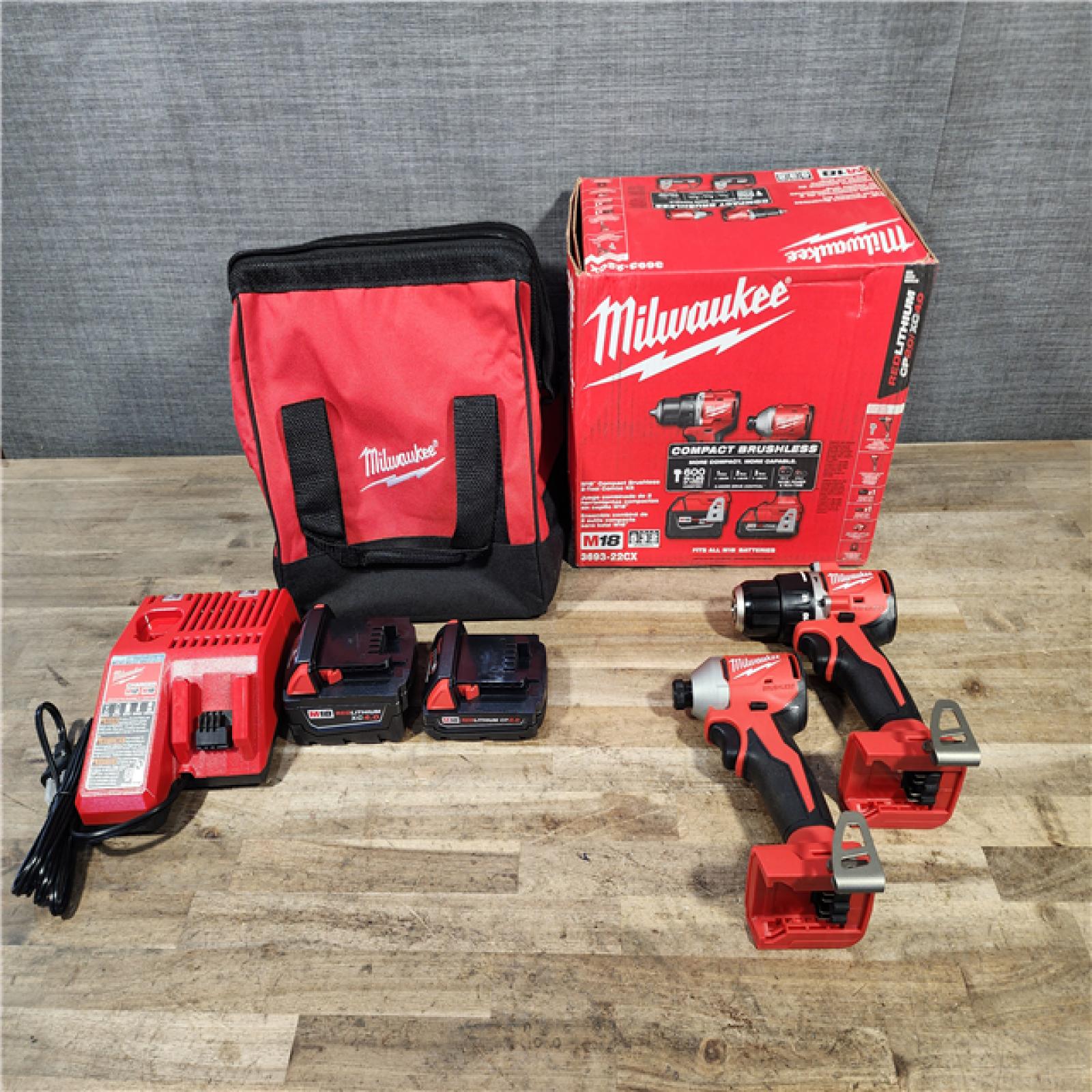 HOUSTON LOCATION - AS-IS M18 18-Volt Lithium-Ion Brushless Cordless Compact Hammer Drill/Impact Combo Kit (2-Tool) with (2) Batteries  Bag