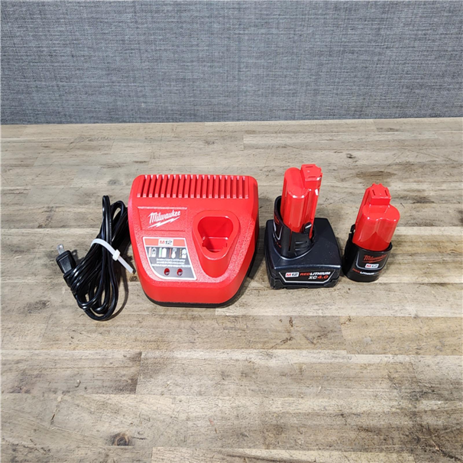 HOUSTON LOCATION - AS-IS MILWAUKEE 2 TOOL COMBO KIT W/ (2) BATTERY & CHARGER