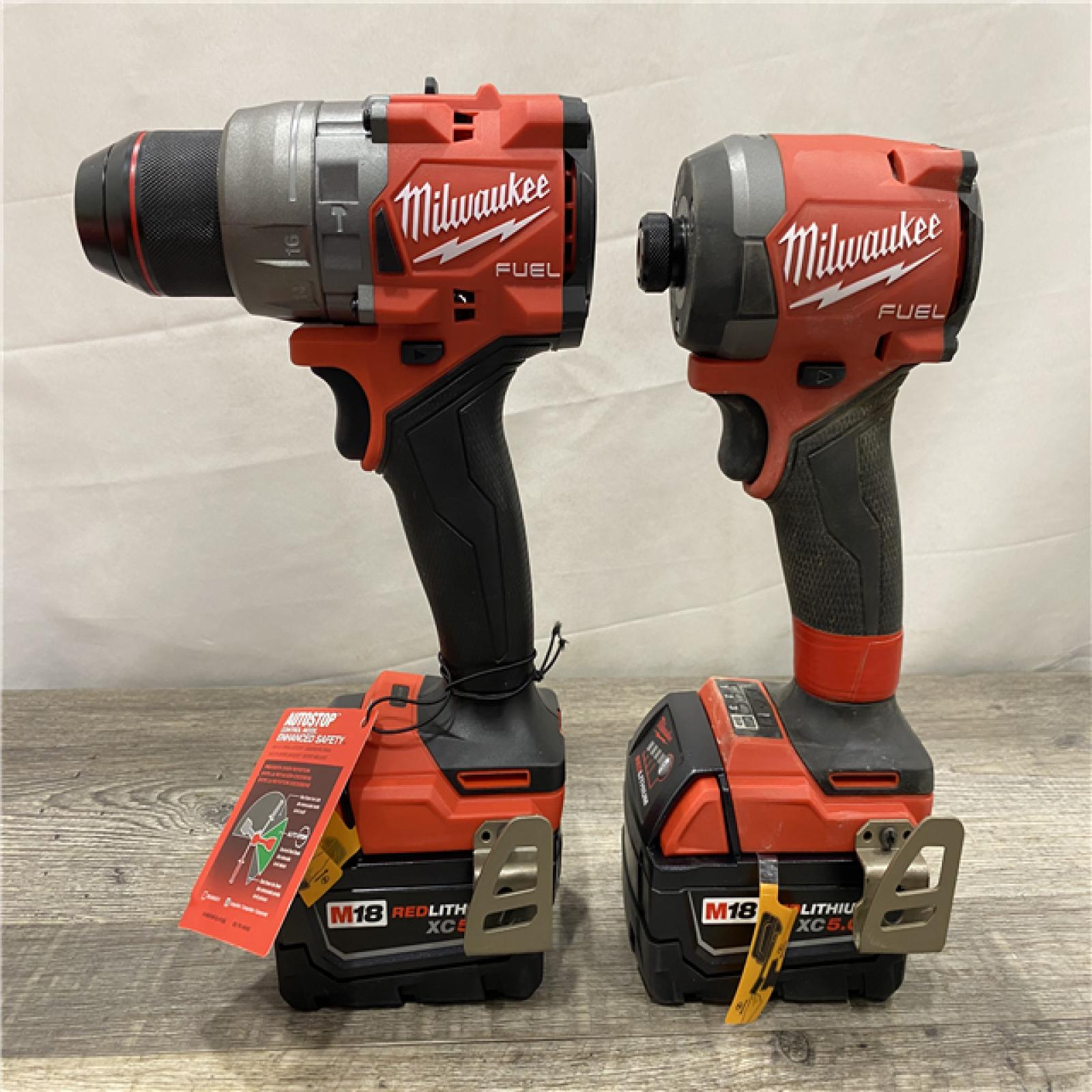 AS-IS Milwaukee FUEL 18V Lithium-Ion Brushless Cordless Hammer Drill and Impact Driver Combo Kit