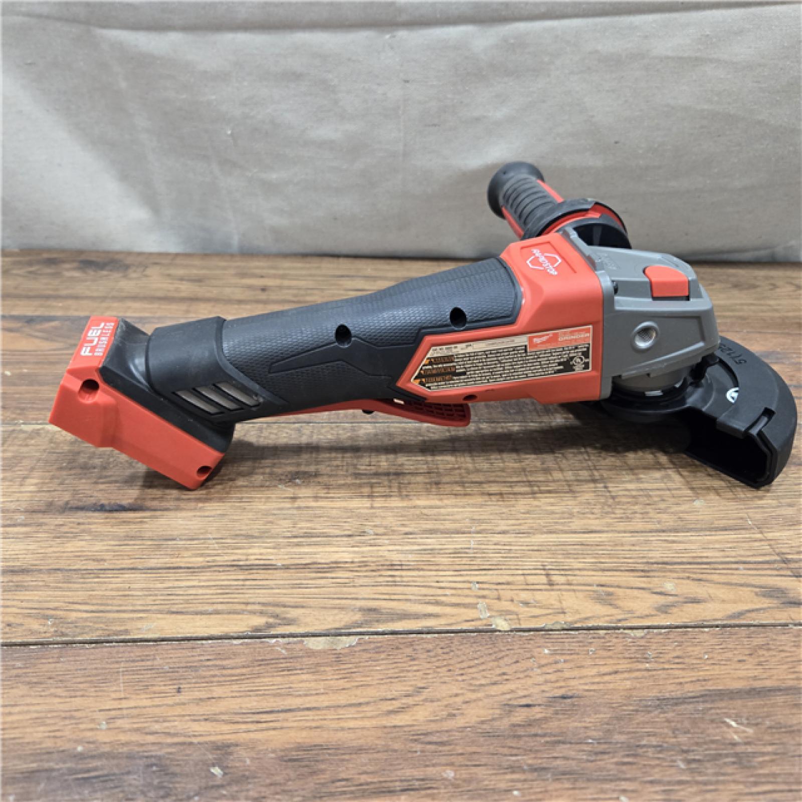 AS-IS Milwaukee 2880-20 FUEL 18-Volt Lithium-Ion Brushless Cordless 4-1/2 in./5 in. Grinder W/Paddle Switch (Tool-Only)