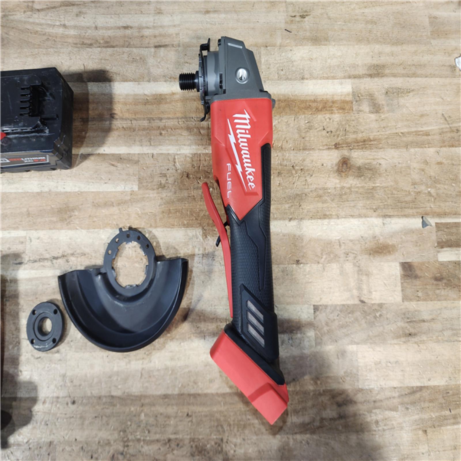 HOUSTON LOCATION - AS - IS Milwaukee FUEL 18V Lithium-Ion Brushless Cordless 4-1/2 in./5 in. Grinder w/Paddle Switch W/ BATTERY & CHARGER