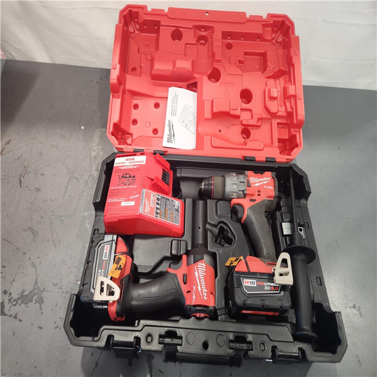 AS-IS- Milwaukee FUEL 18V Lithium-Ion Brushless Cordless Hammer Drill and Impact Driver Combo Kit (2-Tool) with 2 Batteries