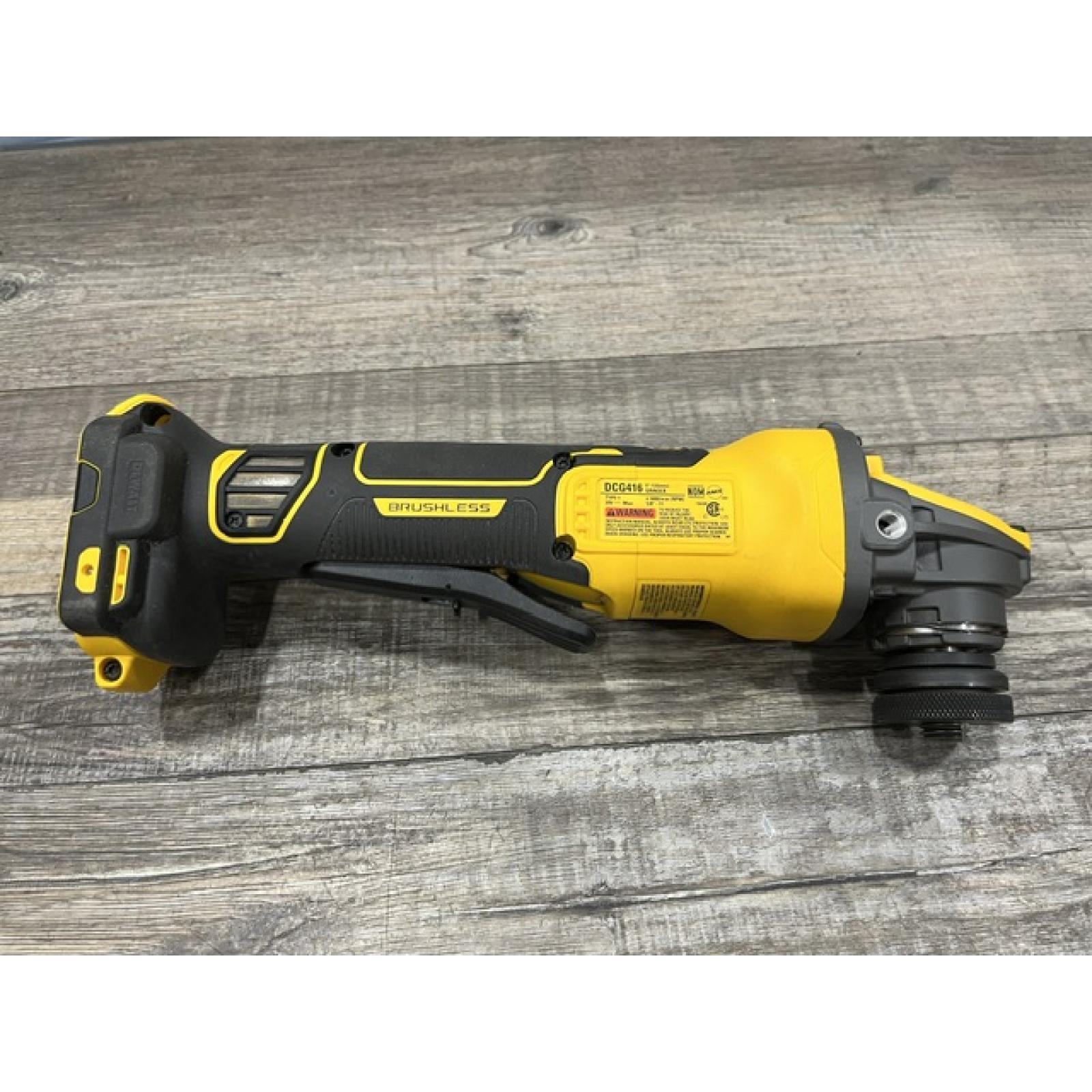 AS-IS DEWALT 20V MAX Cordless Brushless 4.5 - 5 in. Paddle Switch Angle Grinder with FLEXVOLT ADVANTAGE (Tool Only)