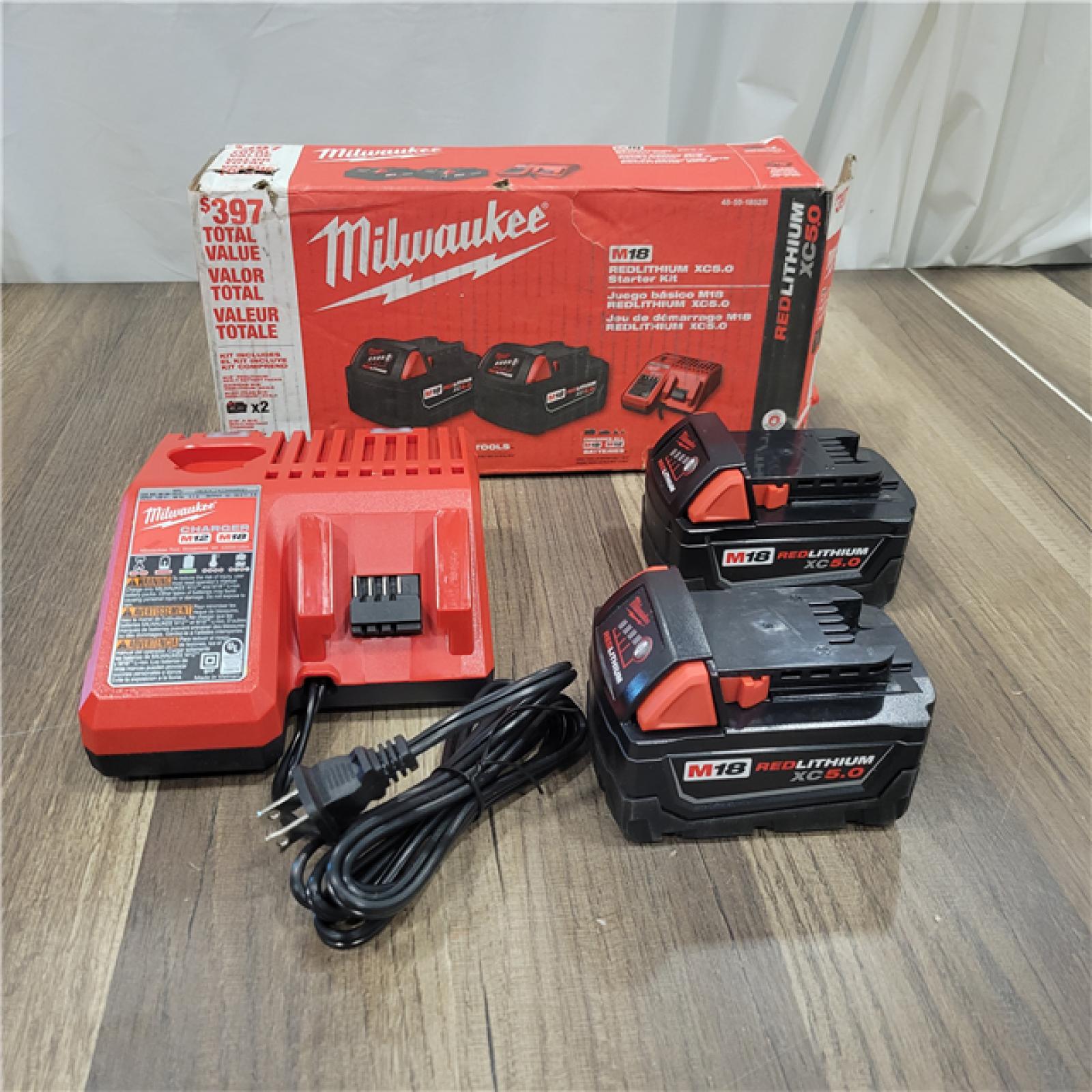 AS-IS  Milwaukee M18 18-Volt Lithium-Ion XC Starter Kit with Two 5.0Ah Batteries and Charger