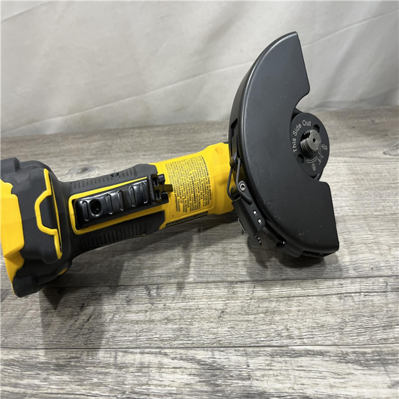 AS-IS DEWALT ATOMIC 20V MAX Cordless 4-1/2 in. Angle Grinder with Paddle Switch (Tool Only)