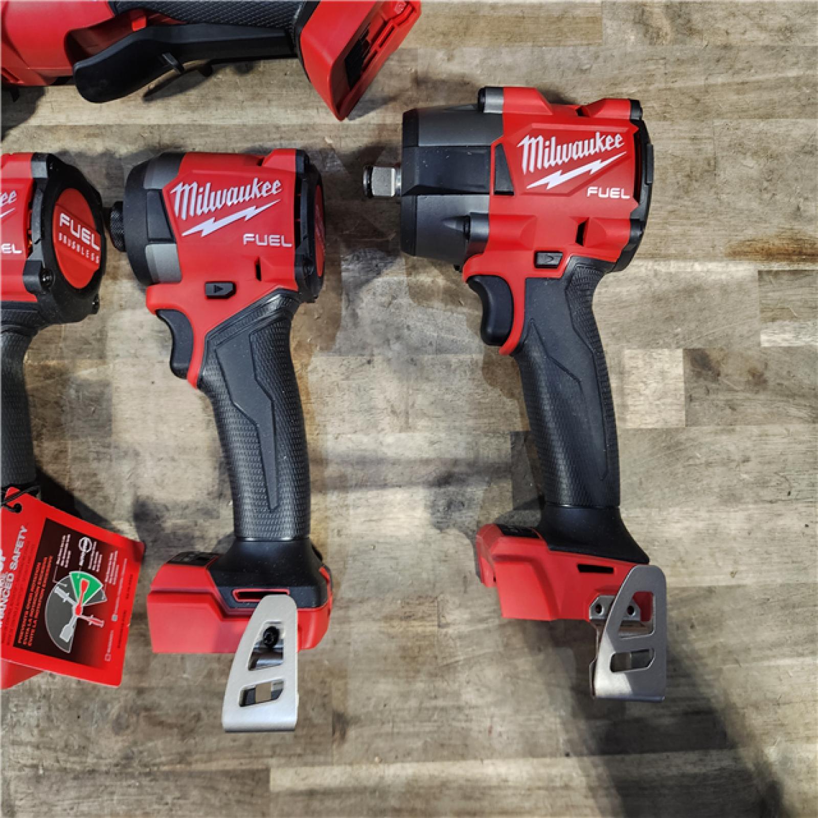 HOUSTON LOCATION - AS-IS (APPEARS LIKE NEW) Milwaukee M18 FUEL 18V Lithium-Ion Brushless Cordless Combo Kit with Two 5.0 Ah Batteries  1 Charger  2 Tool Bags (7-Tool)