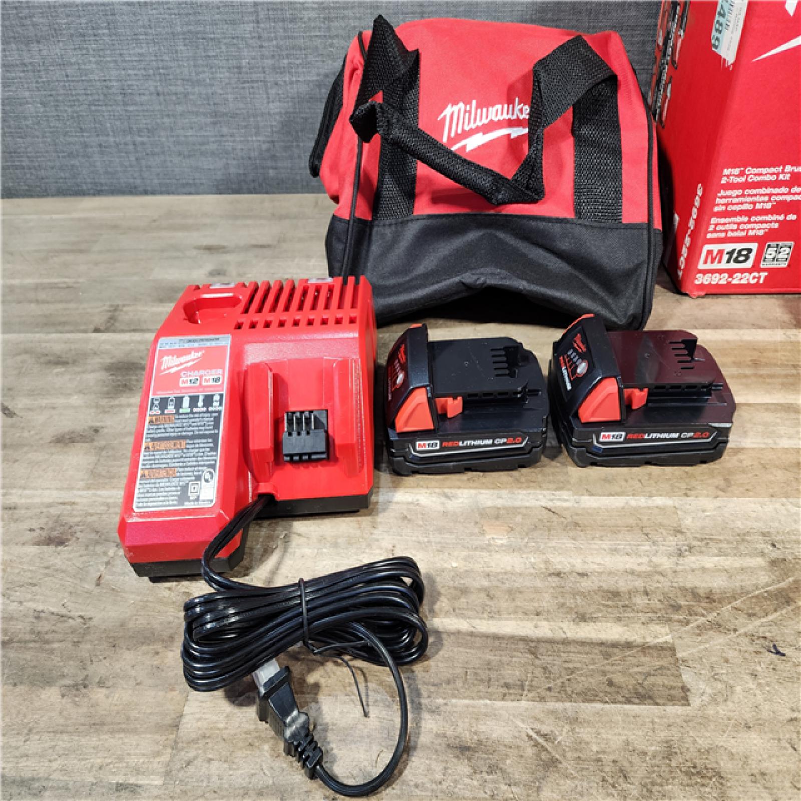 HOUSTON LOCATION - AS-IS Milwaukee M18 18V Lithium-Ion Brushless Cordless Compact Drill/Impact Combo Kit (2-Tool) W/(2) 2.0 Ah Batteries  Charger & Bag
