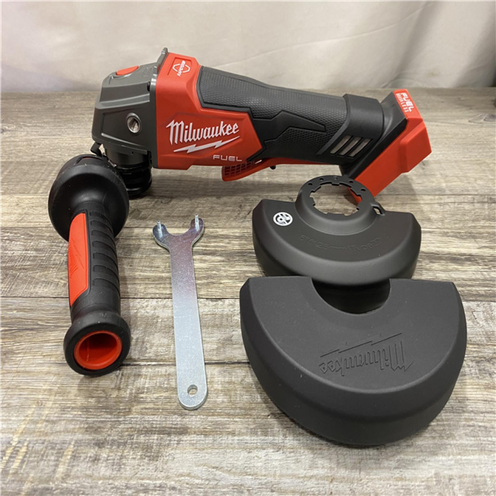 AS-IS Milwaukee FUEL 18V Lithium-Ion Brushless Cordless 4-1/2 in./5 in. Grinder w/Paddle Switch (Tool-Only)