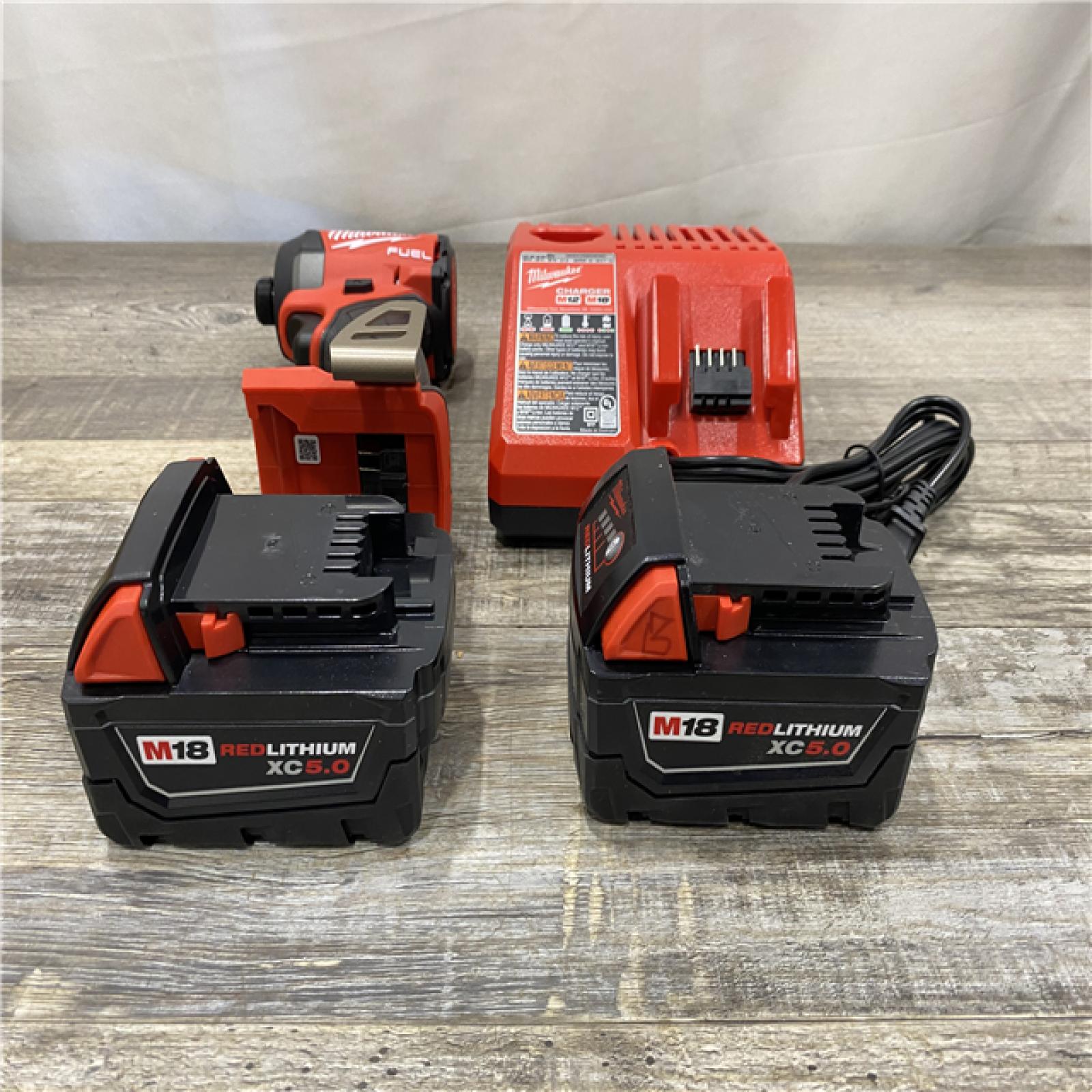 AS-IS Milwaukee FUEL 18V Lithium-Ion Brushless Cordless 1/4 in. Hex Impact Driver Kit