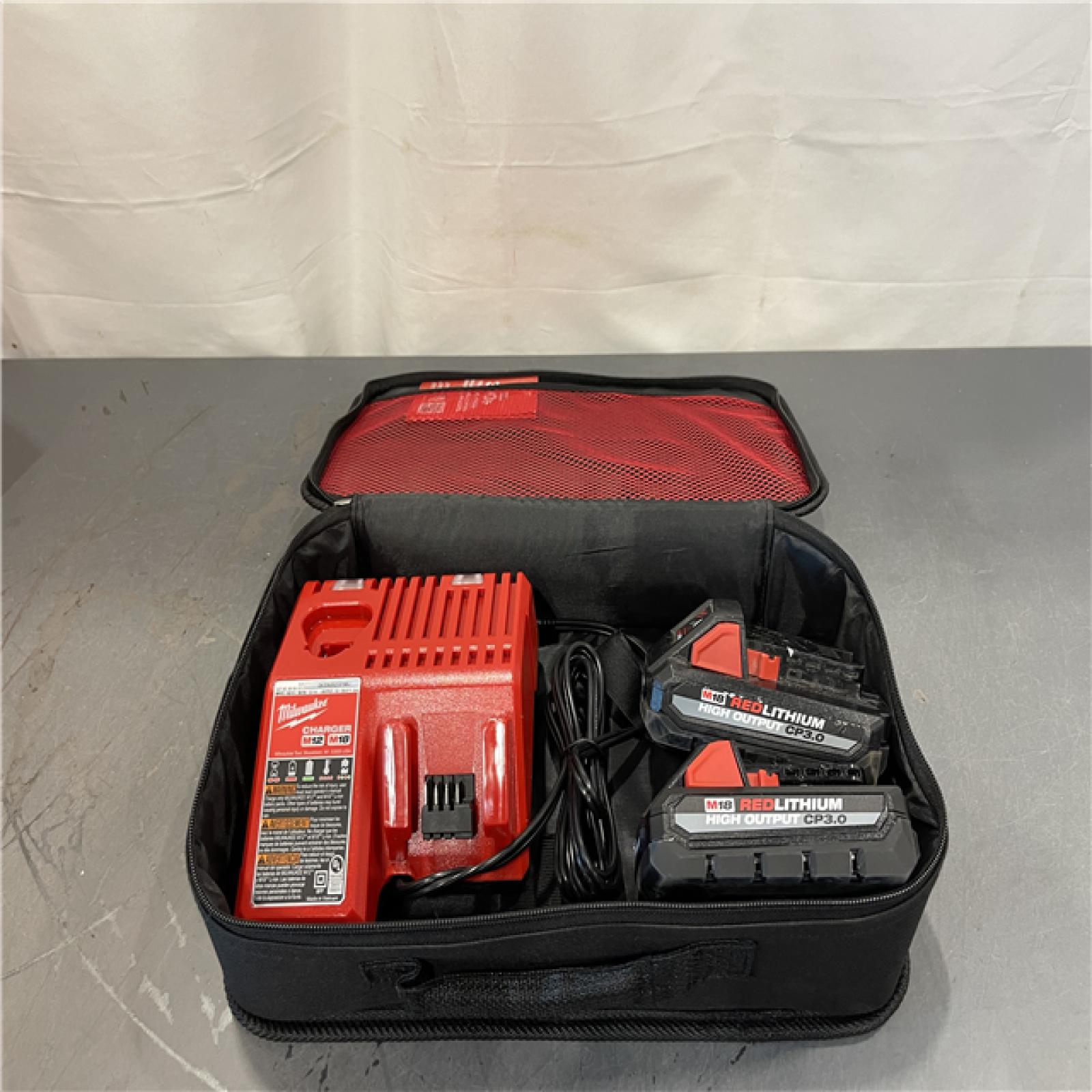 AS-IS - Milwaukee M18 18-Volt Lithium-Ion HIGH OUTPUT CP 3.0Ah Battery (2-Pack) AND M12 M18 CHARGER