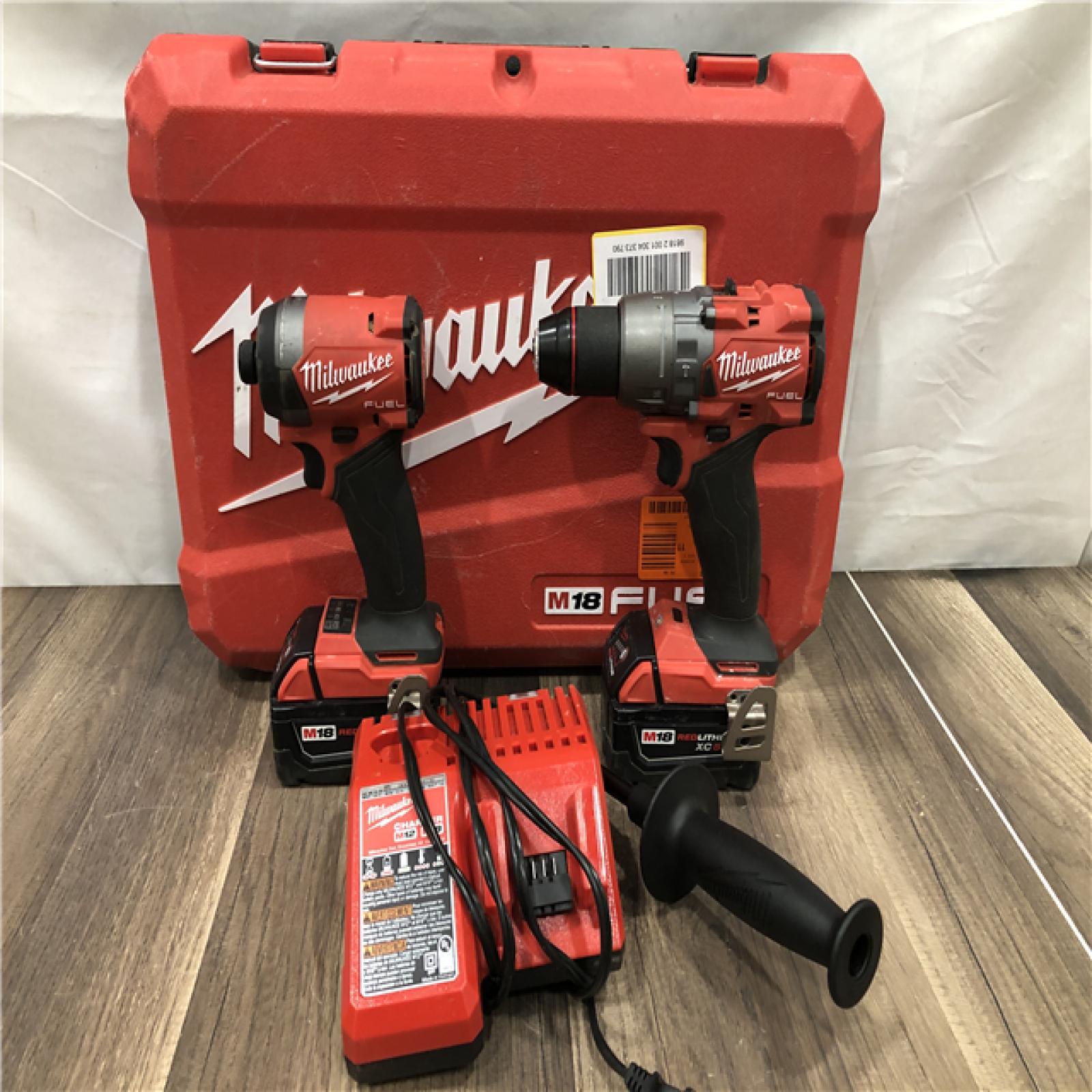 AS-IS Milwaukee FUEL 18V Lithium-Ion Brushless Cordless Hammer Drill and Impact Driver Combo Kit