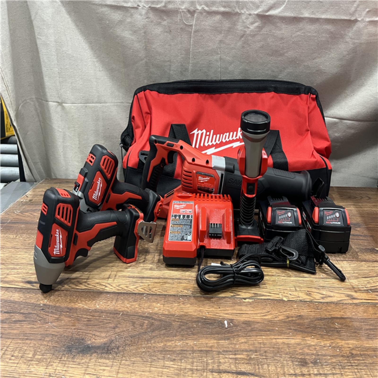 AS-IS MILWAUKEE M18 18V Lithium-Ion Cordless Combo Tool Kit with Two 3.0Ah Batteries, 1-Charger, 1-Tool Bag (4-Tool)
