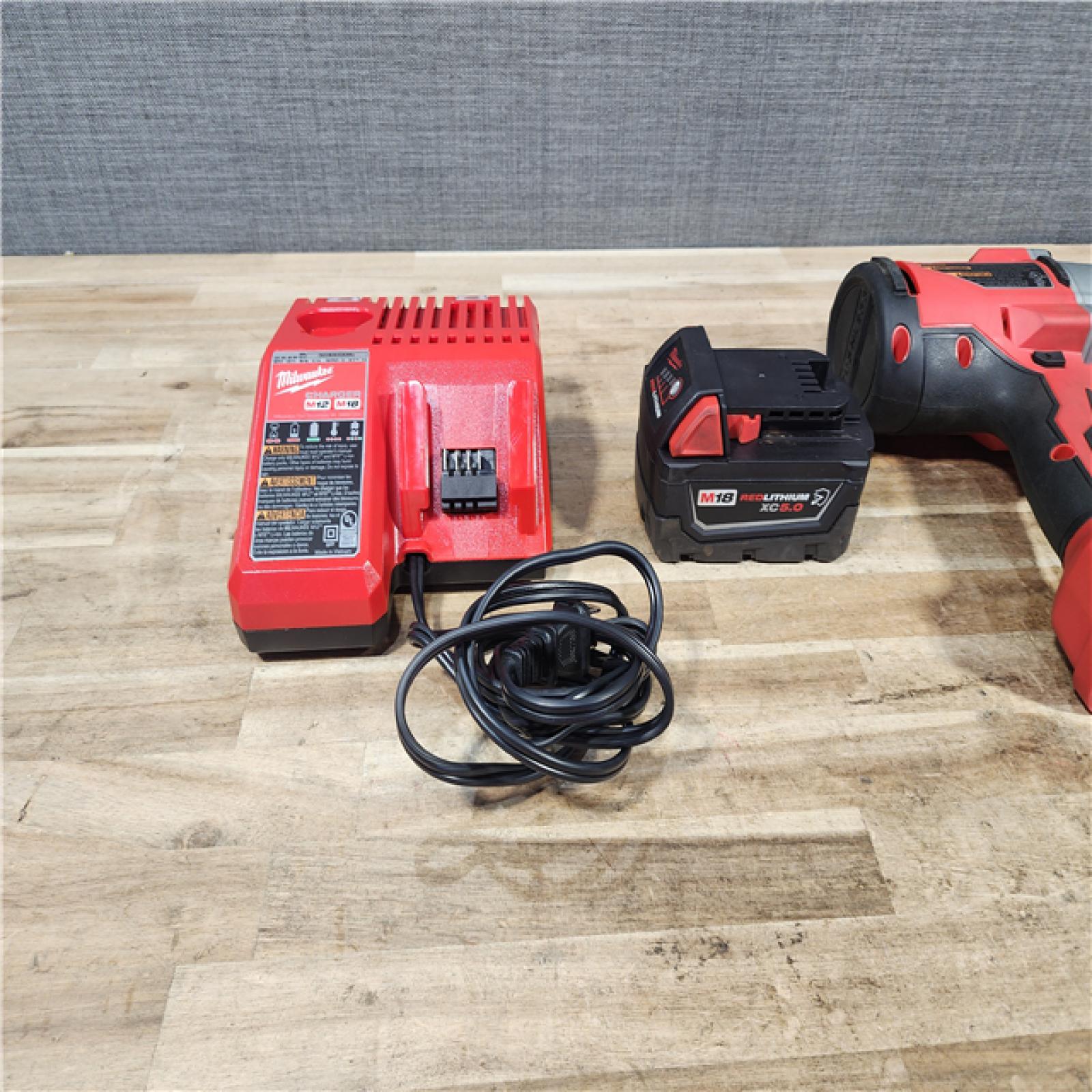 HOUSTON LOCATION - AS - IS Milwaukee 18-Volt Lithium-Ion Brushless 1/2 in. High Torque Impact Wrench with Friction Ring W/ BATTERY & CHARGER