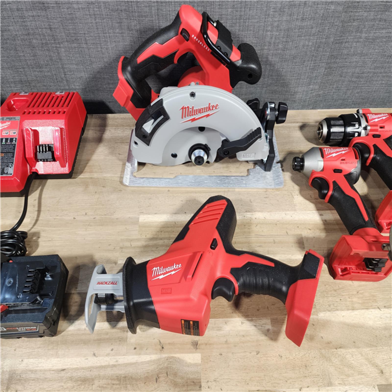 HOUSTON LOCATION - AS-IS Milwaukee M18 18-Volt Lithium-Ion Brushless Cordless Combo Kit (4-Tool) with 2-Batteries, 1-Charger and Tool Bag