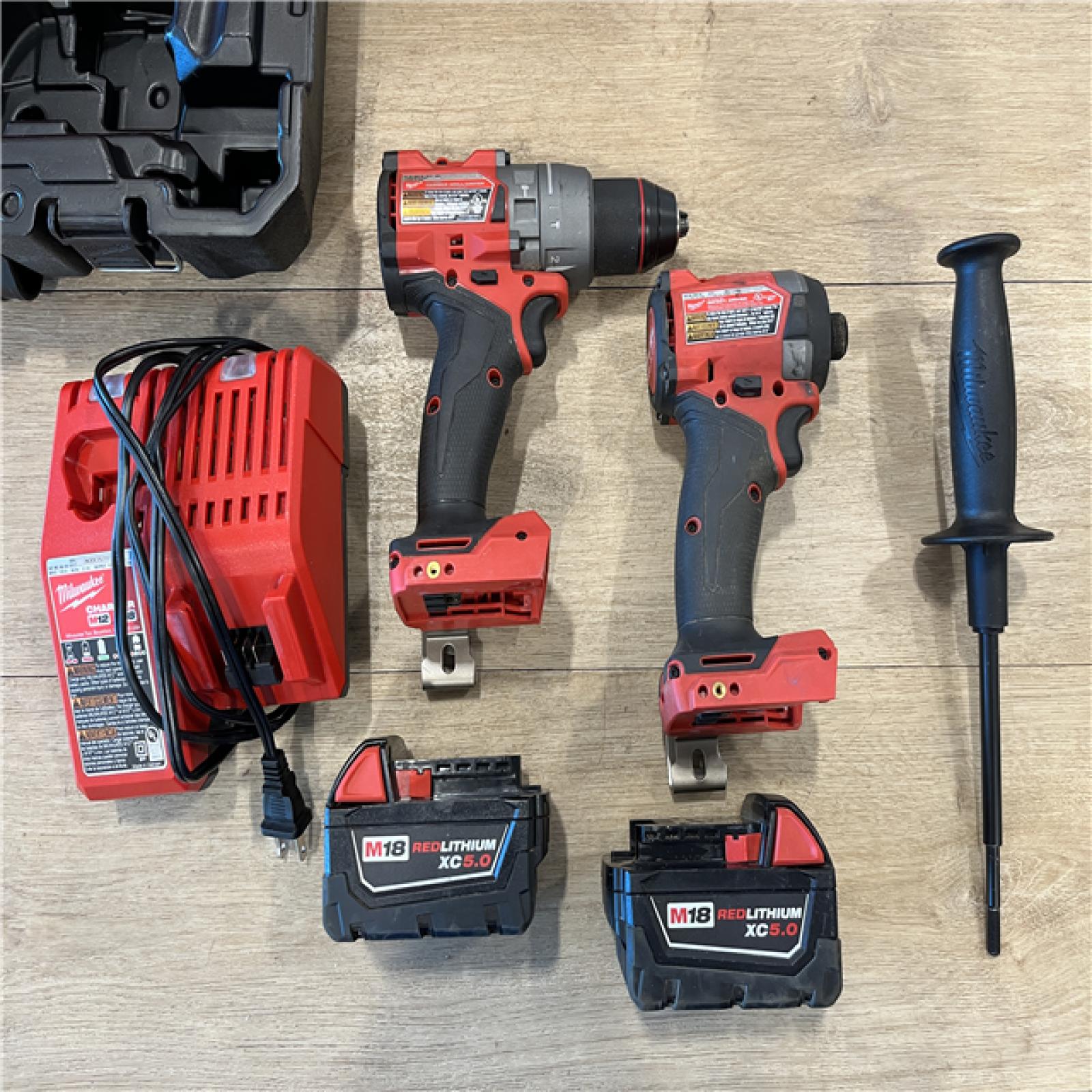AS-IS Milwaukee FUEL 18V Lithium-Ion Brushless Cordless Hammer Drill and Impact Driver Combo Kit