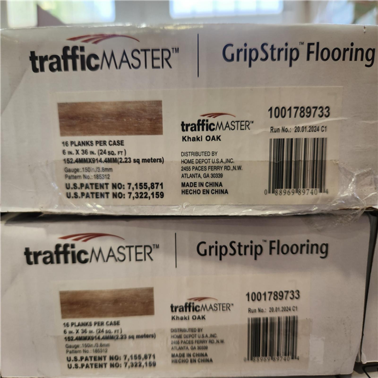 Phoenix TrafficMaster Khaki Oak 4 MIL x 6 in. W x 36 in. L Grip Strip Water Resistant Luxury Vinyl Plank Flooring (1 152 sqft/ 48 case)