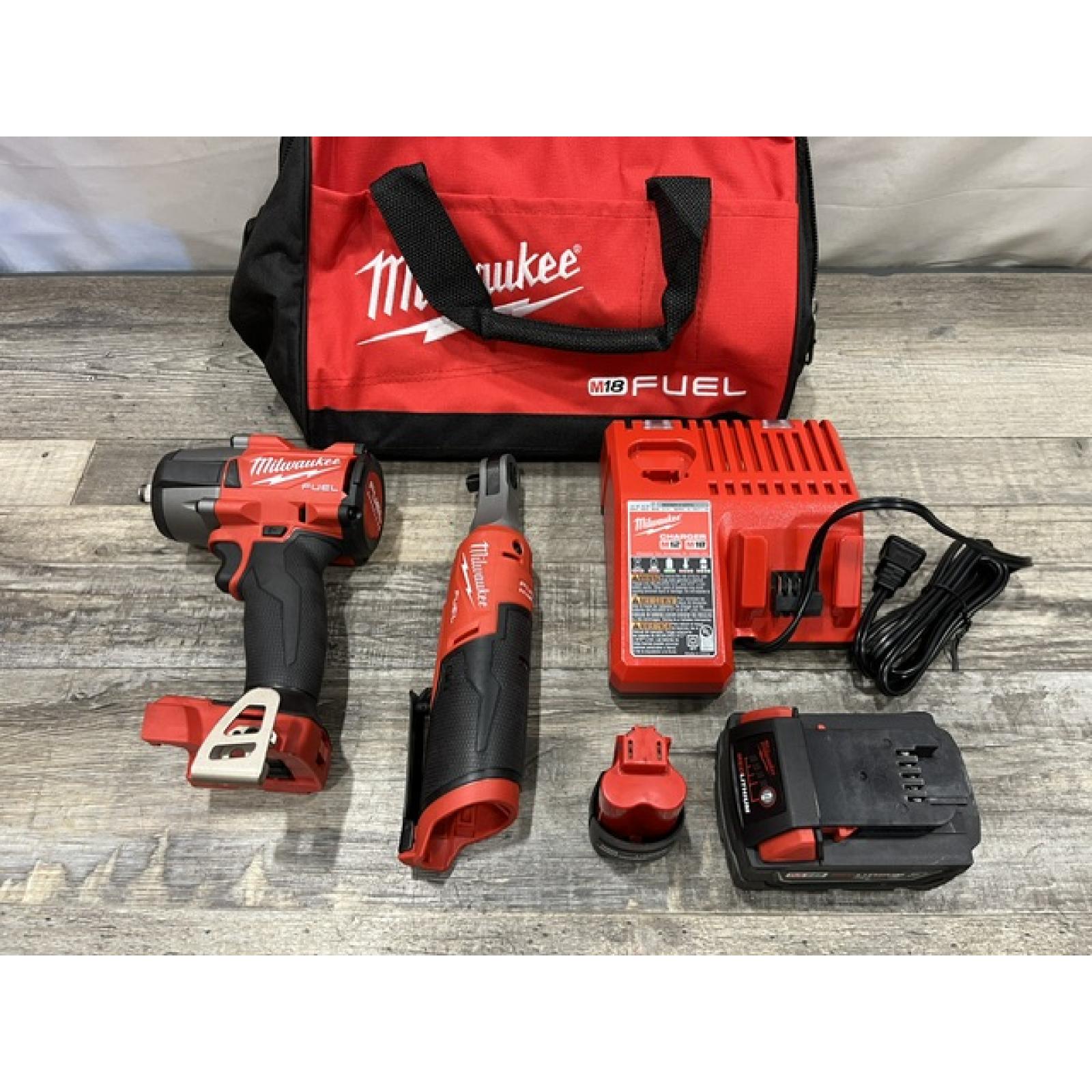 AS-IS Milwaukee FUEL 18V Cordless Mid Torque 1/2 in. Impact Wrench w/ 12 FUEL 3/8 in. Ratchet Combo Kit