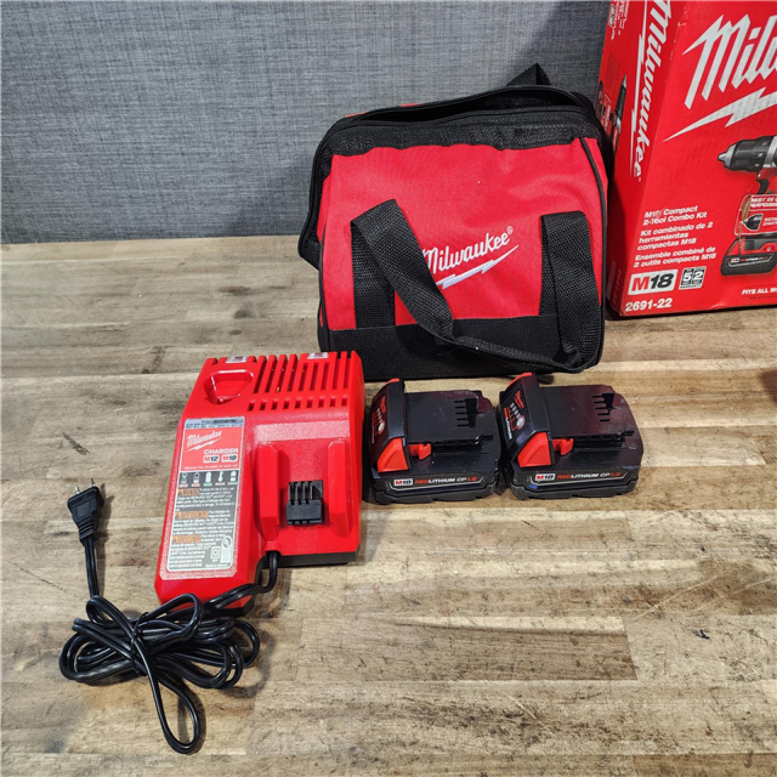 HOUSTON LOCATION - AS-IS Milwaukee 18V Lithium-Ion Cordless Drill Driver/Impact Driver Combo Kit