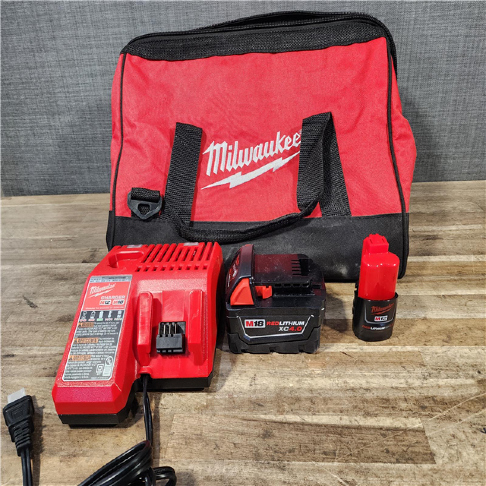 HOUSTON LOCATION - AS-IS Milwaukee 12/18V Lithium-Ion Cordless 3/8 in. Ratchet and 1/2 in. High Torque Impact Wrench with Friction Ring Combo Kit