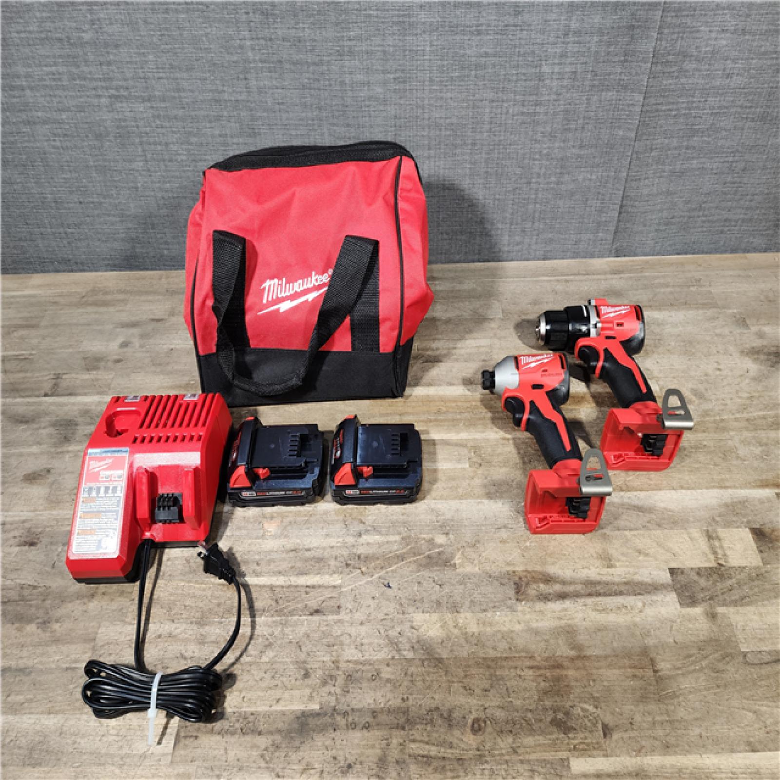 HOUSTON LOCATION - AS-IS Milwaukee M18 18V Lithium-Ion Brushless Cordless Compact Drill/Impact Combo Kit (2-Tool) W/(2) 2.0 Ah Batteries  Charger & Bag