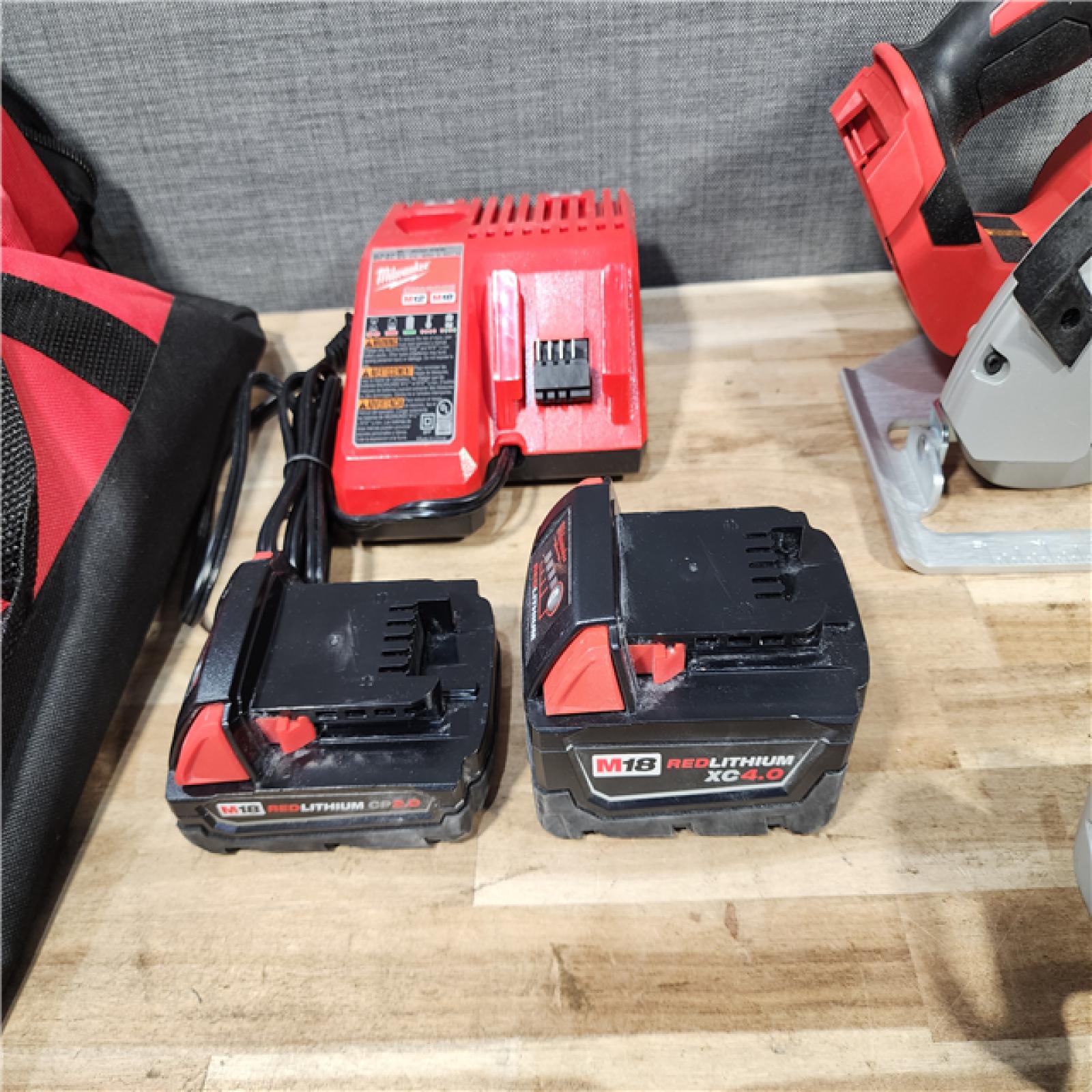 HOUSTON LOCATION - AS-IS MILWAUKEE 4 TOOL COMBO KIT W/ (2) BATTERY & CHARGER