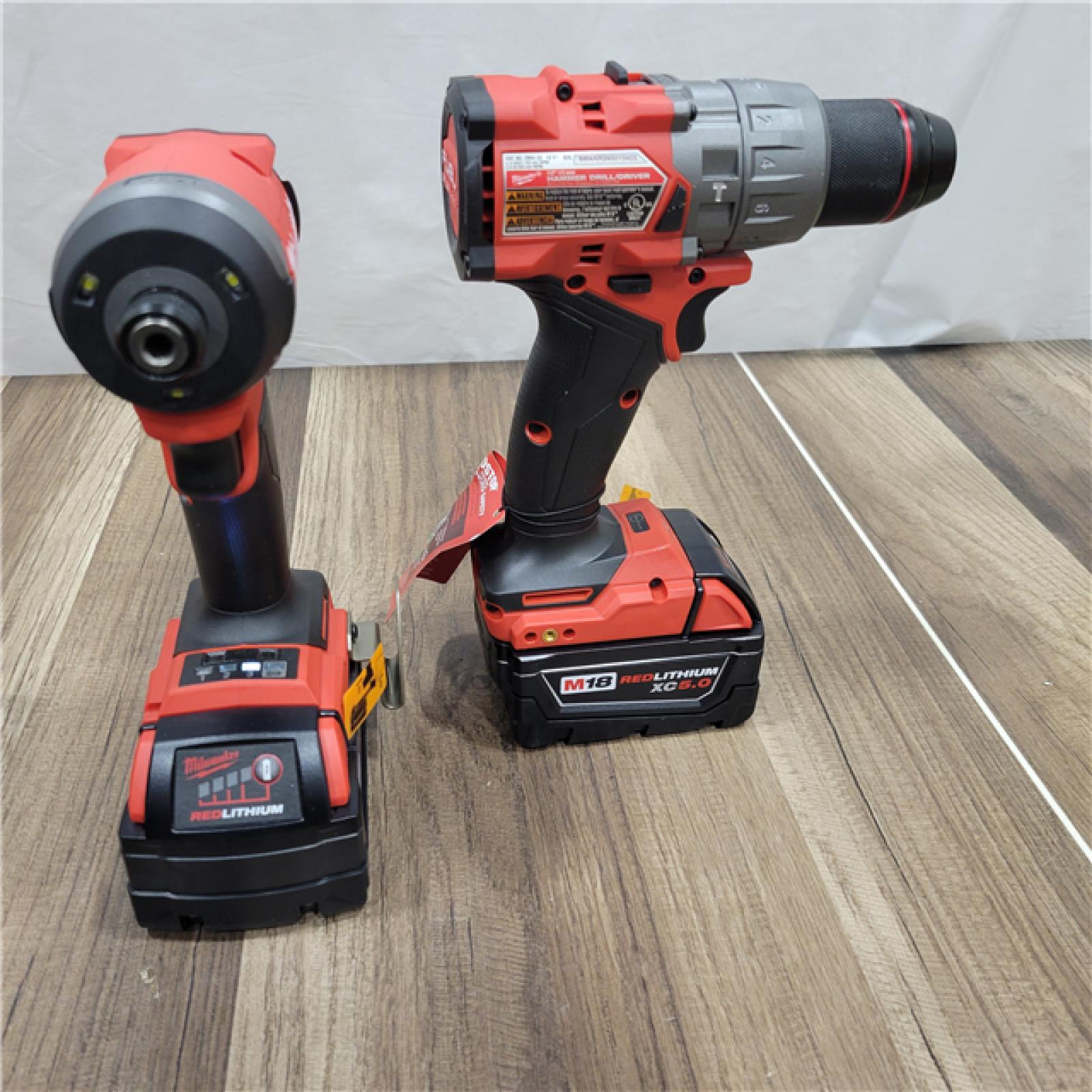 AS-IS Milwaukee M18 FUEL 18V Lithium-Ion Brushless Cordless Hammer Drill and Impact Driver Combo Kit (2-Tool) with 2 Batteries