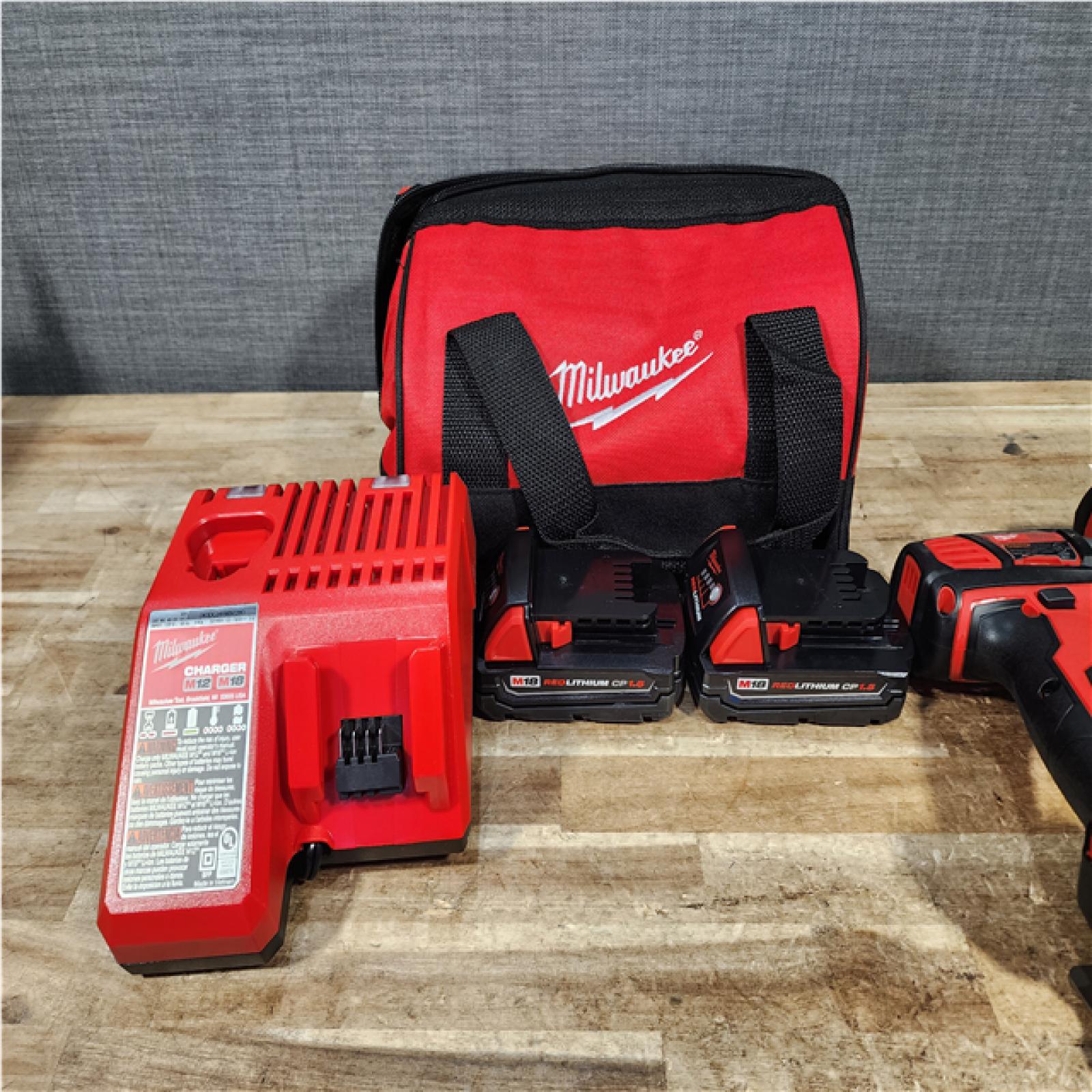 HOUSTON LOCATION - AS - IS Milwaukee 18V Lithium-Ion Cordless Drill Driver/Impact Driver Combo Kit