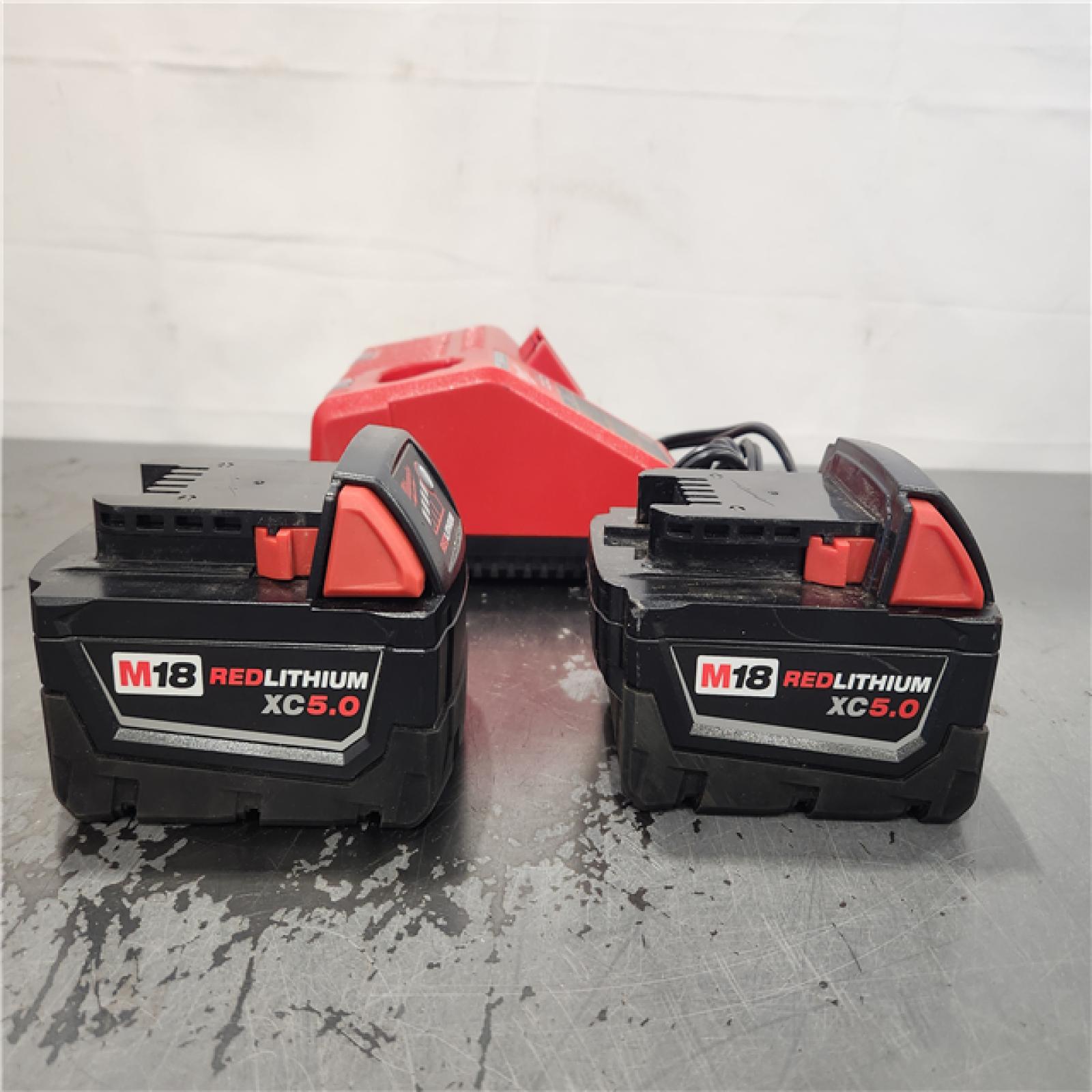 AS-IS- Milwaukee 18-Volt Lithium-Ion XC Starter Kit with Two 5.0Ah Batteries and Charger