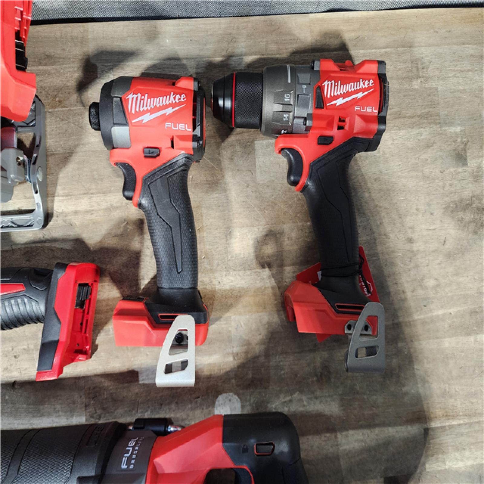HOUSTON LOCATION - AS-IS (APPEARS LIKE NEW) M18 FUEL 18V Lithium-Ion Brushless Cordless 5-Tool Combo Kit with Two 5.0 Ah Batteries  1 Charger 1 Tool Bag