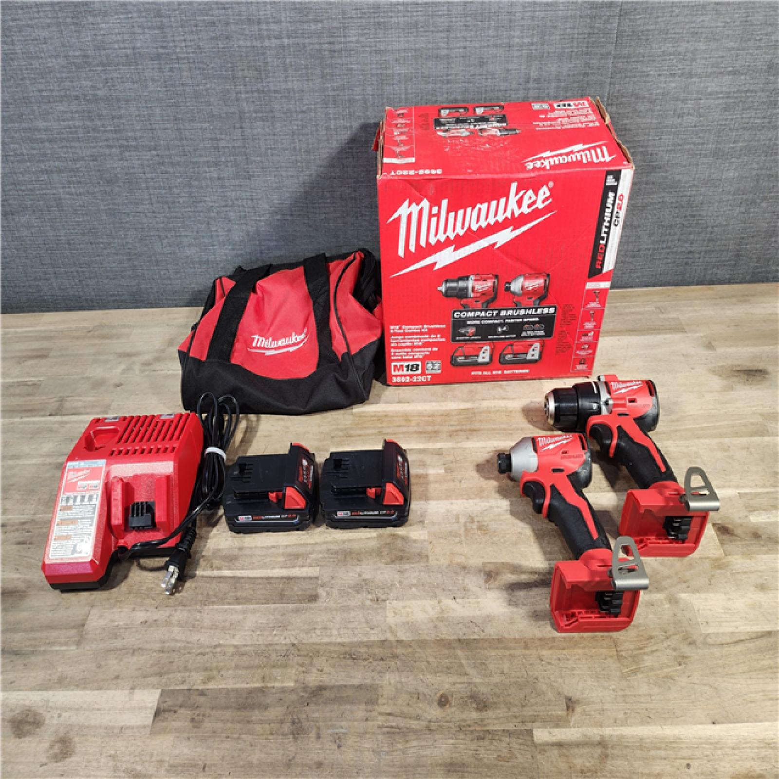 HOUSTON LOCATION - AS-IS Milwaukee M18 18V Lithium-Ion Brushless Cordless Compact Drill/Impact Combo Kit (2-Tool) W/(2) 2.0 Ah Batteries, Charger & Bag