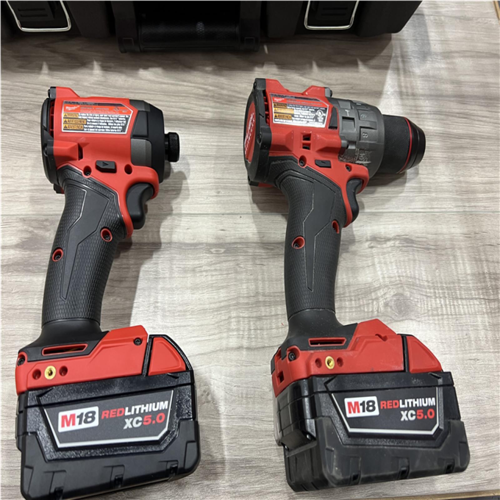 AS-IS Milwaukee FUEL 18V Lithium-Ion Brushless Cordless Hammer Drill and Impact Driver Combo Kit