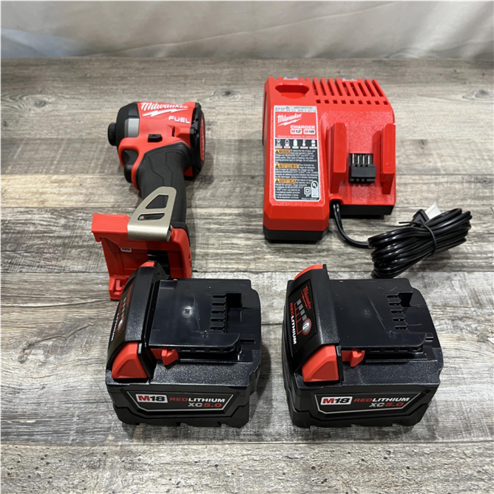 AS-IS Milwaukee FUEL 18V Lithium-Ion Brushless Cordless 1/4 in. Hex Impact Driver Kit