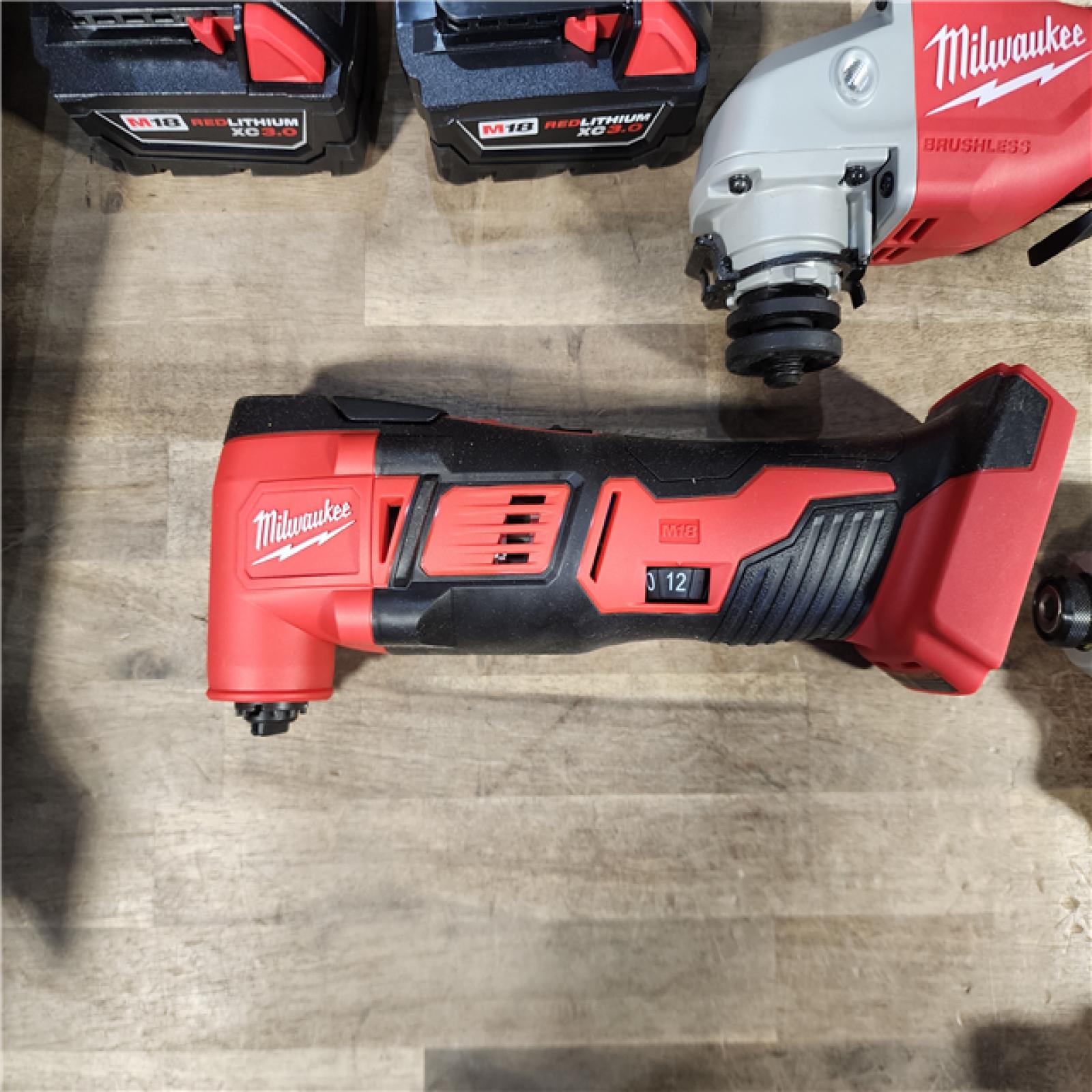 HOUSTON LOCATION - AS-IS Milwaukee M18 18-Volt Lithium-Ion Cordless Combo Kit 7-Tool with 2-Batteries, Charger and Tool Bag
