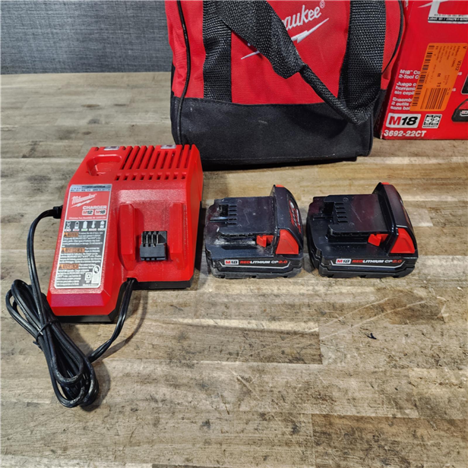 HOUSTON LOCATION - AS-IS Milwaukee M18 18V Lithium-Ion Brushless Cordless Compact Drill/Impact Combo Kit (2-Tool) W/(2) 2.0 Ah Batteries  Charger & Bag