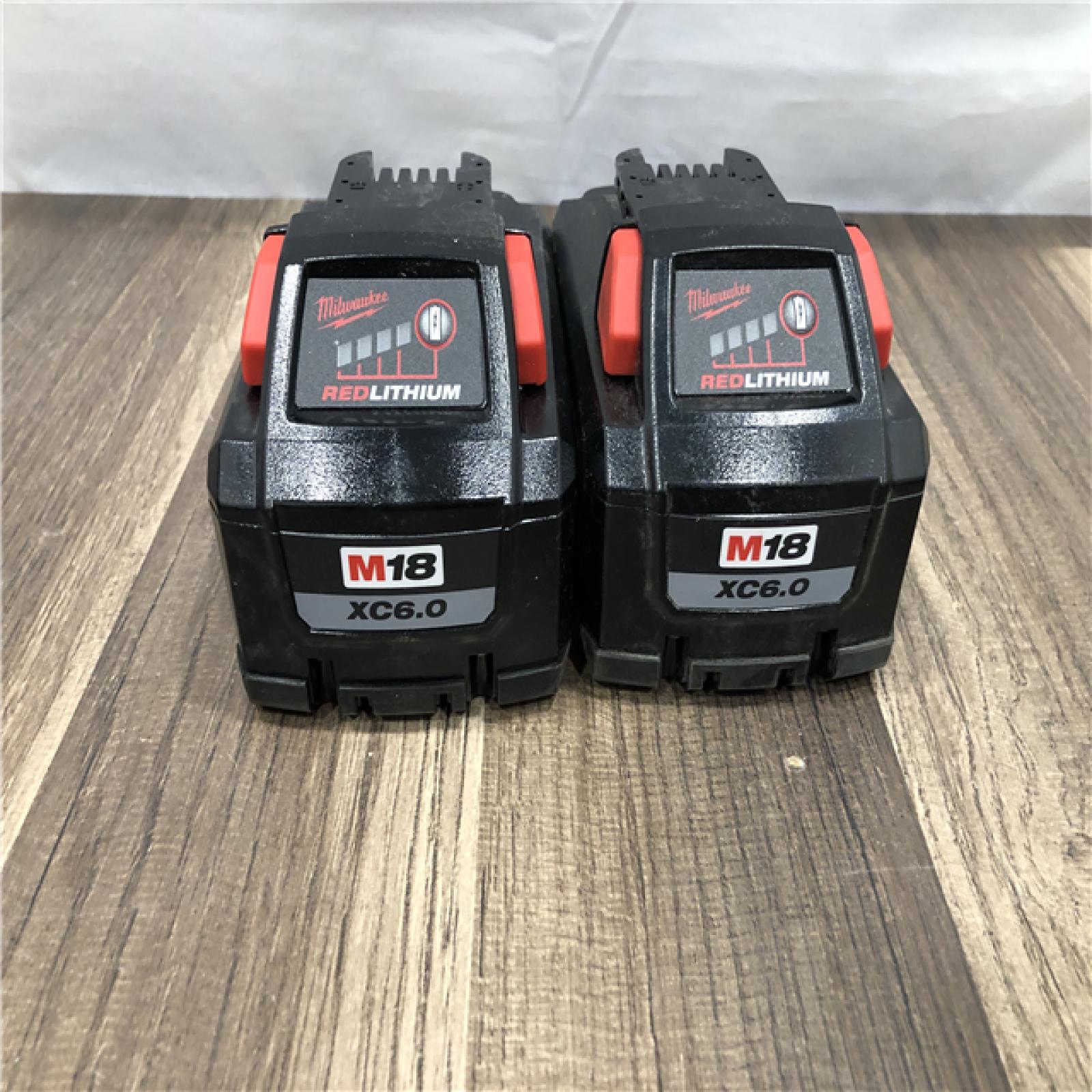 AS-IS Milwaukee 18-Volt Lithium-Ion Battery Pack (2) 5.0Ah and High Output Battery Pack (2) 6.0Ah with PACKOUT 6-Port Rapid Charger