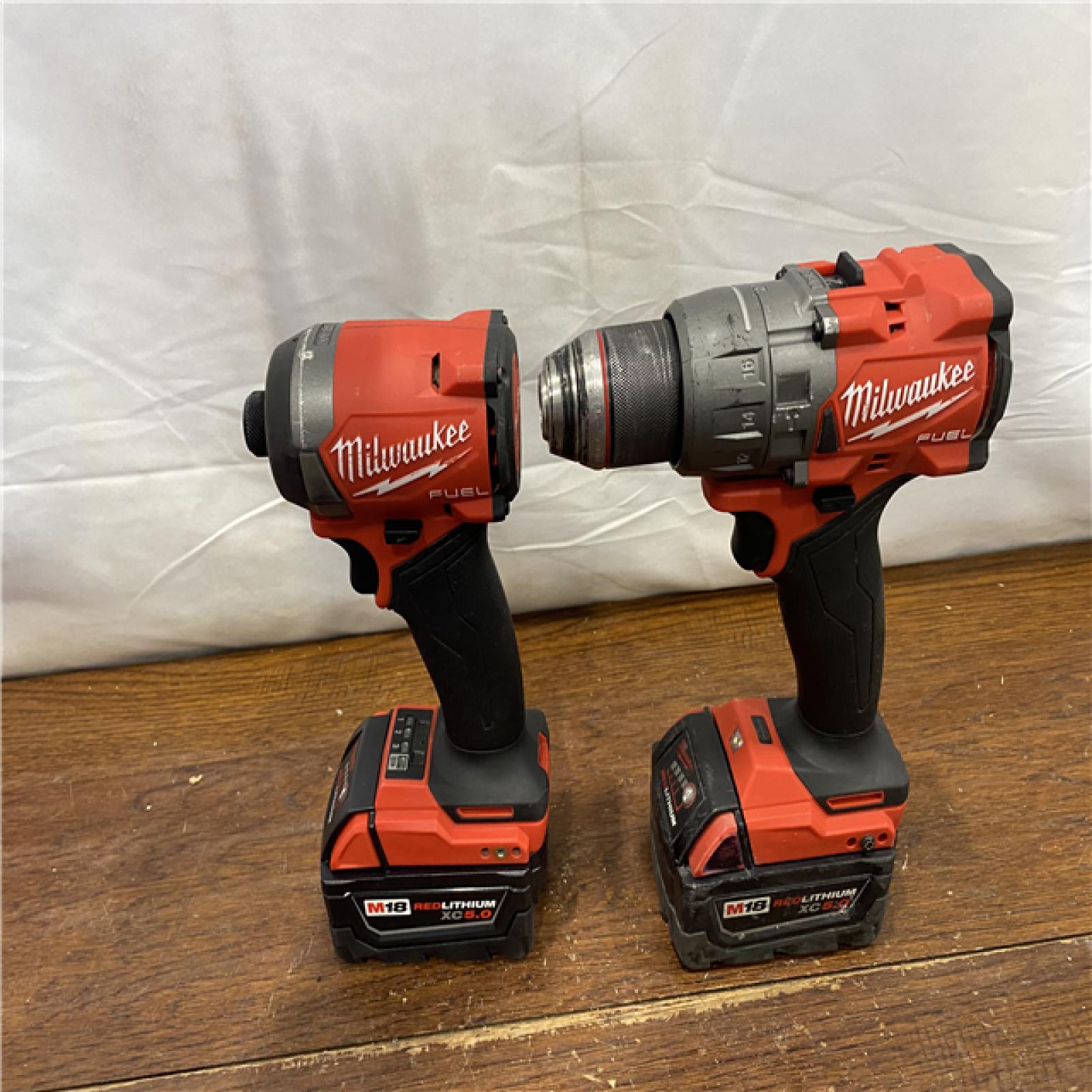 AS-IS MILWAUKEE M18 FUEL 18V Lithium-Ion Brushless Cordless Hammer Drill and Impact Driver Combo Kit (2-Tool) with 2 Batteries