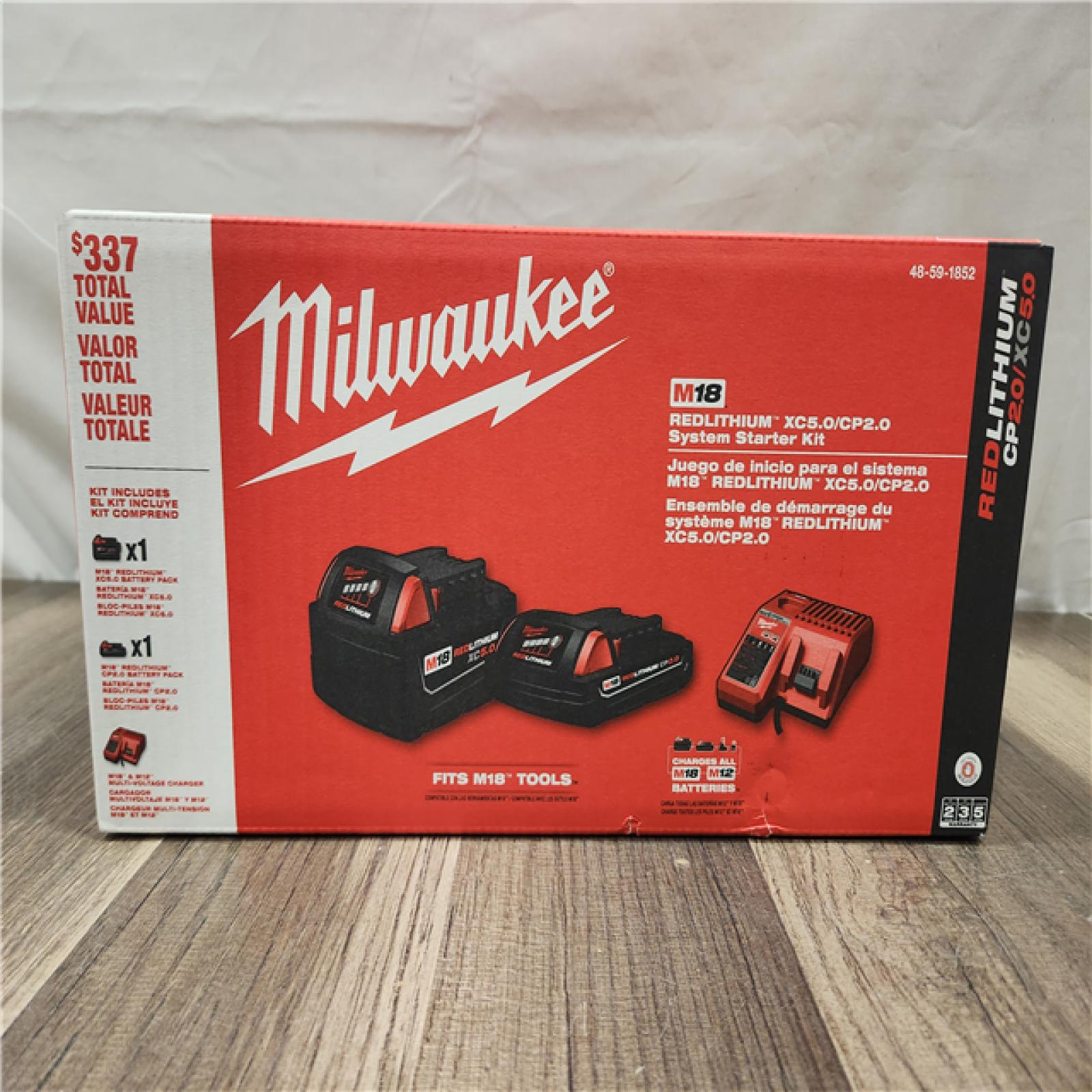 NEW- Milwaukee M18 18-Volt Lithium-Ion Starter Kit with One 5.0 Ah and One 2.0 Ah Battery and Charger