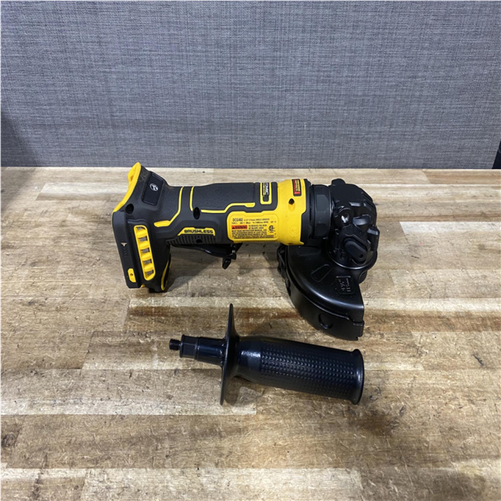 Houston Location AS-IS DEWALT ATOMIC 20V MAX Cordless 4-1/2 in. Angle Grinder with Paddle Switch (Tool Only)
