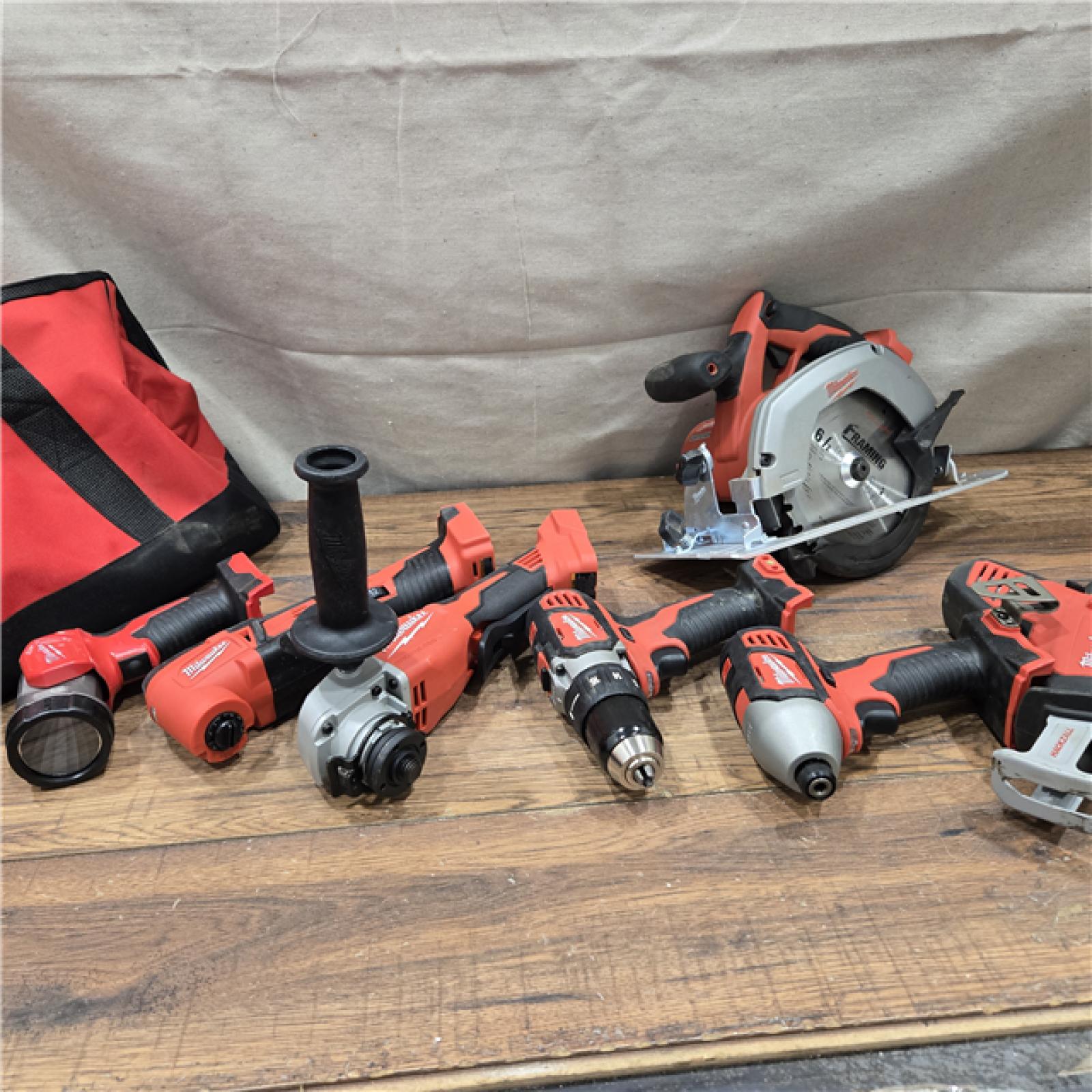 AS-IS Milwaukee M18 18-Volt Lithium-Ion Cordless Combo Kit 7-Tool with 2-Batteries, Charger and Tool Bag