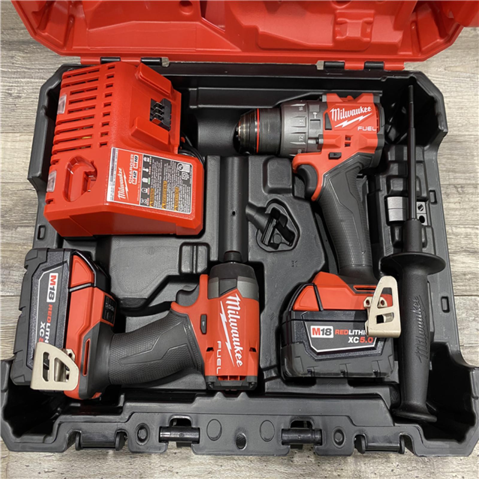 AS-IS Milwaukee FUEL 18V Lithium-Ion Brushless Cordless Hammer Drill and Impact Driver Combo Kit