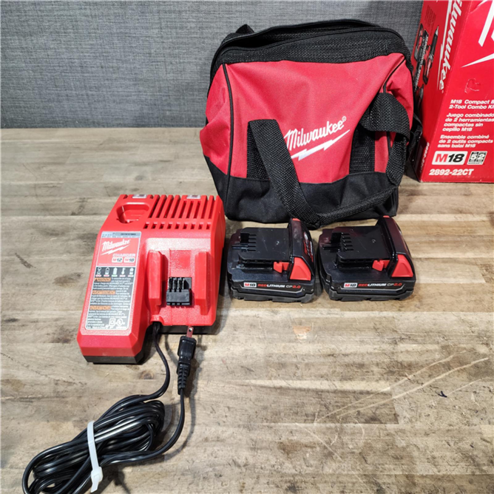 HOUSTON LOCATION - AS-IS Milwaukee 2892-22CT 18V M18 Lithium-Ion Compact Brushless Cordless 2-Tool Combo Kit with 1/2 Drill/Driver and 1/4 Hex Impact Driver 2.0 Ah