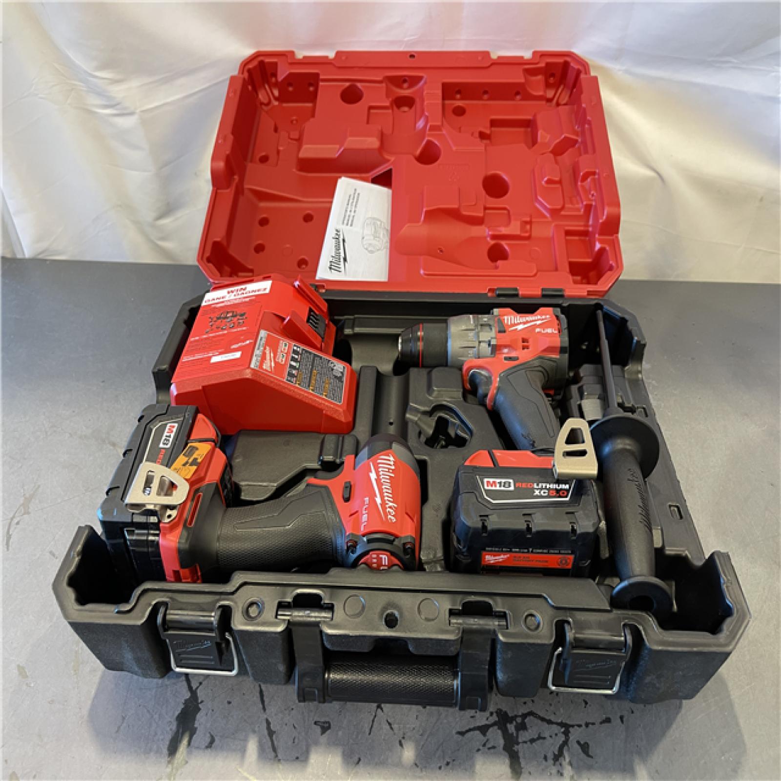 AS-IS - Milwaukee M18 FUEL 18V Lithium-Ion Brushless Cordless Hammer Drill and Impact Driver Combo Kit