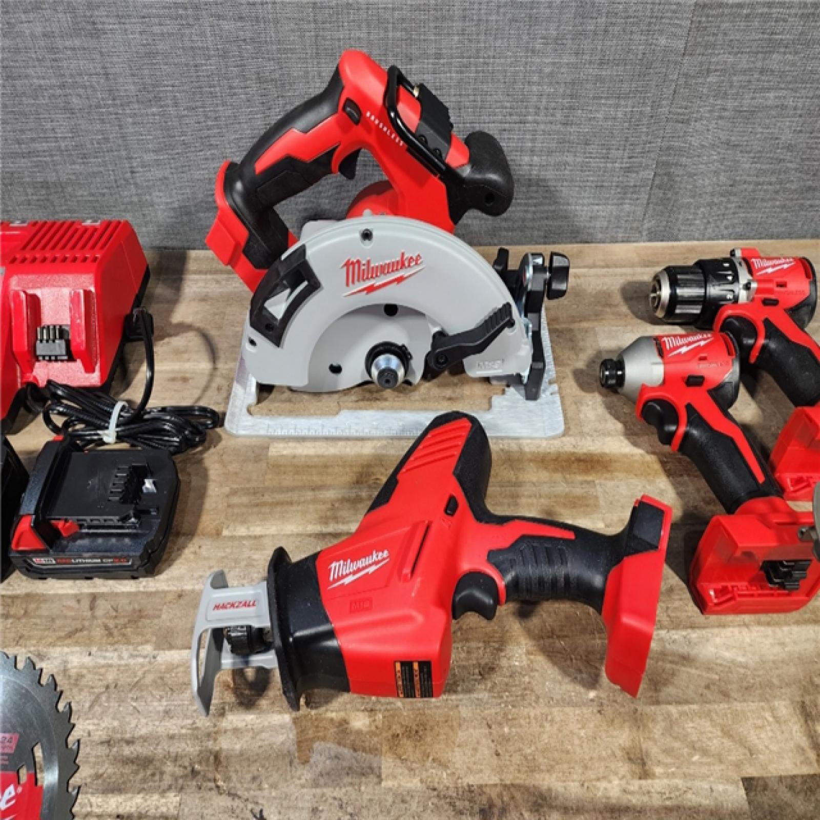 HOUSTON LOCATION - AS-IS Milwaukee M18 18-Volt Lithium-Ion Brushless Cordless Combo Kit (4-Tool) with 2-Batteries, 1-Charger and Tool Bag