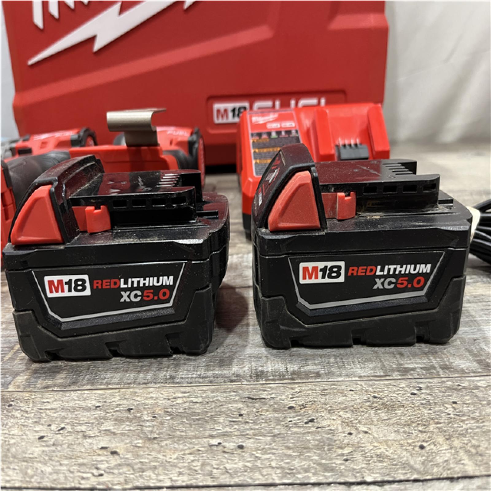 AS-IS Milwaukee FUEL 18V Lithium-Ion Brushless Cordless Hammer Drill and Impact Driver Combo Kit