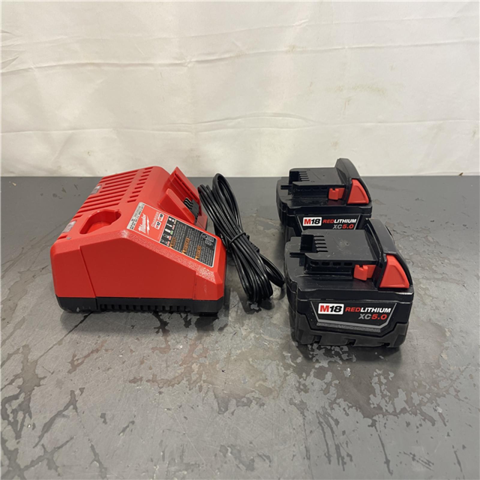 AS-IS- Milwaukee M18 18-Volt Lithium-Ion XC Starter Kit with Two 5.0Ah Batteries and Charger