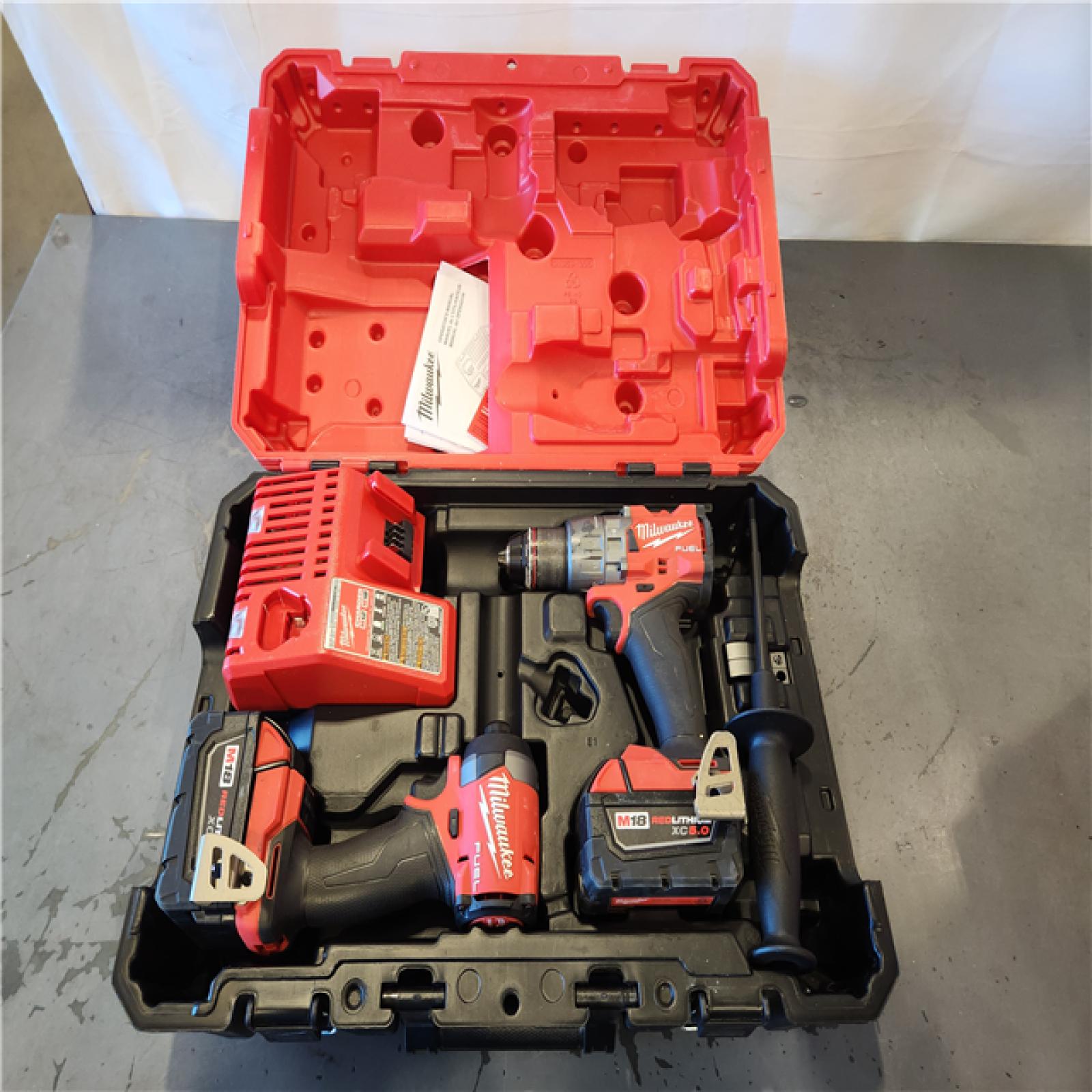 AS-IS- Milwaukee FUEL 18V Lithium-Ion Brushless Cordless Hammer Drill and Impact Driver Combo Kit
