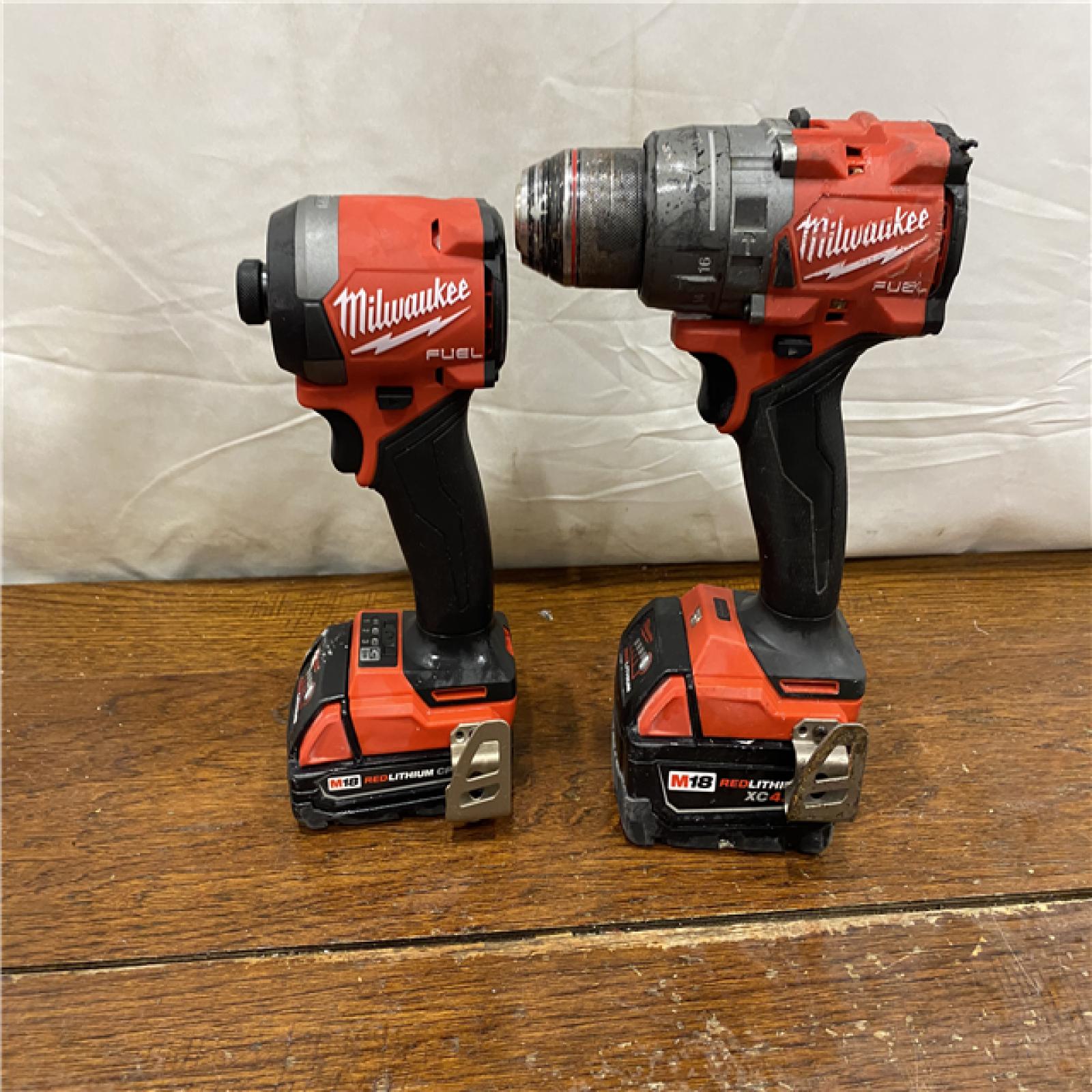 AS-IS MILWAUKEE M18 FUEL 18V Lithium-Ion Brushless Cordless Hammer Drill and Impact Driver Combo Kit (2-Tool) with 2 Batteries