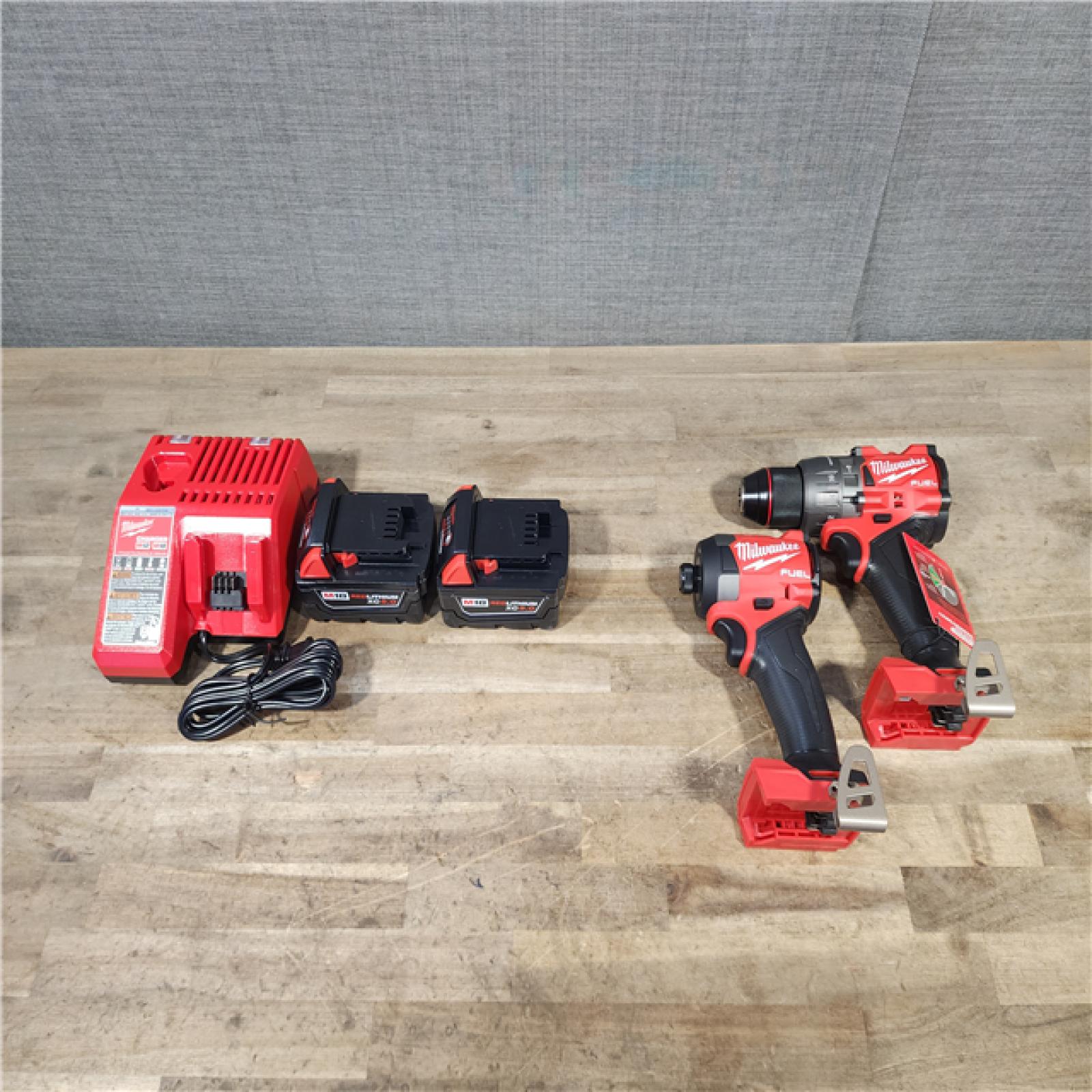 HOUSTON LOCATION - AS-IS (APPEARS LIKE NEW) Milwaukee M18 FUEL 18V Lithium-Ion Brushless Cordless Hammer Drill and Impact Driver Combo Kit